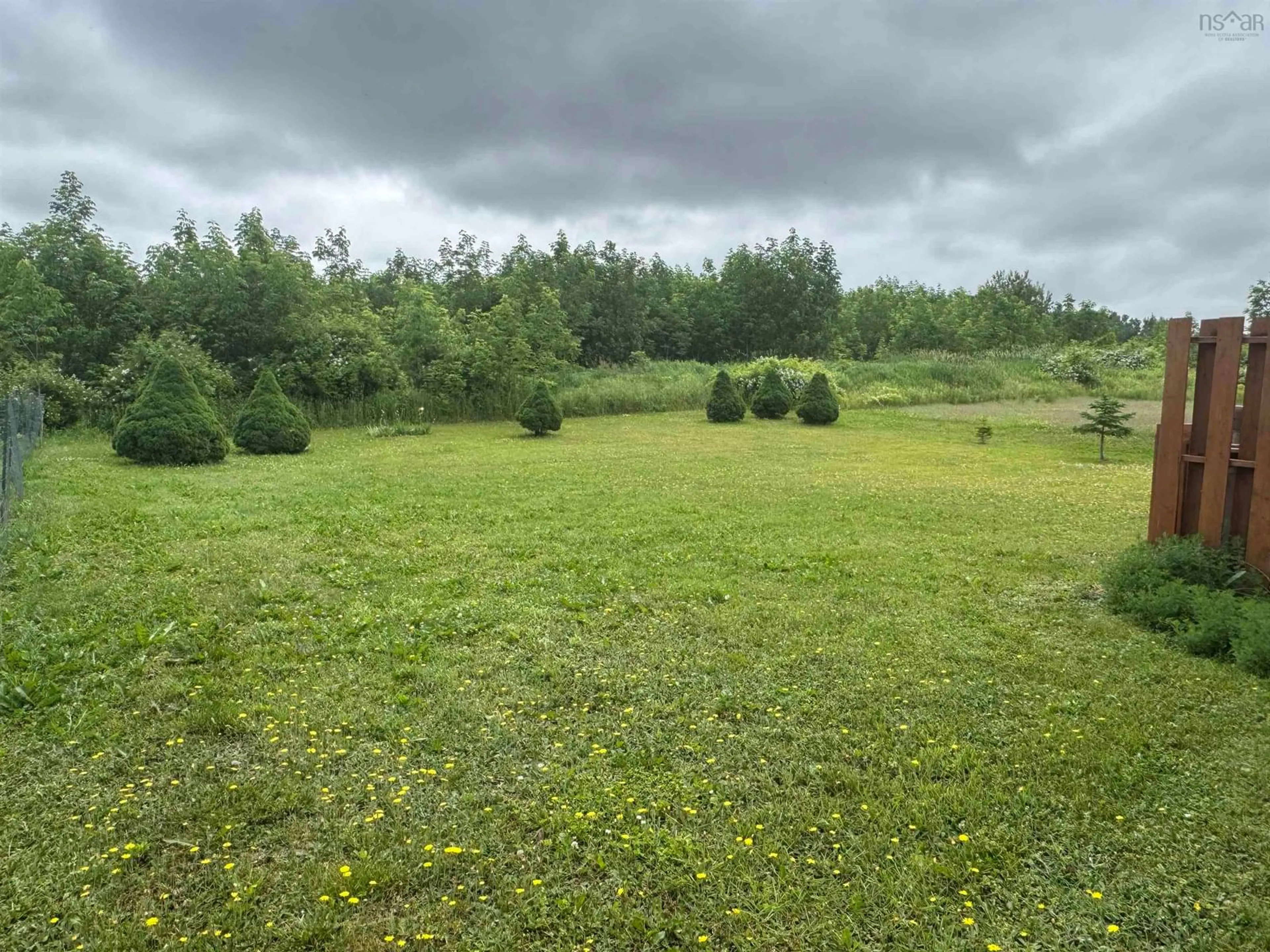 A pic from outside/outdoor area/front of a property/back of a property/a pic from drone, forest/trees view for 2386 North Ave, Canning Nova Scotia B0P 1H0