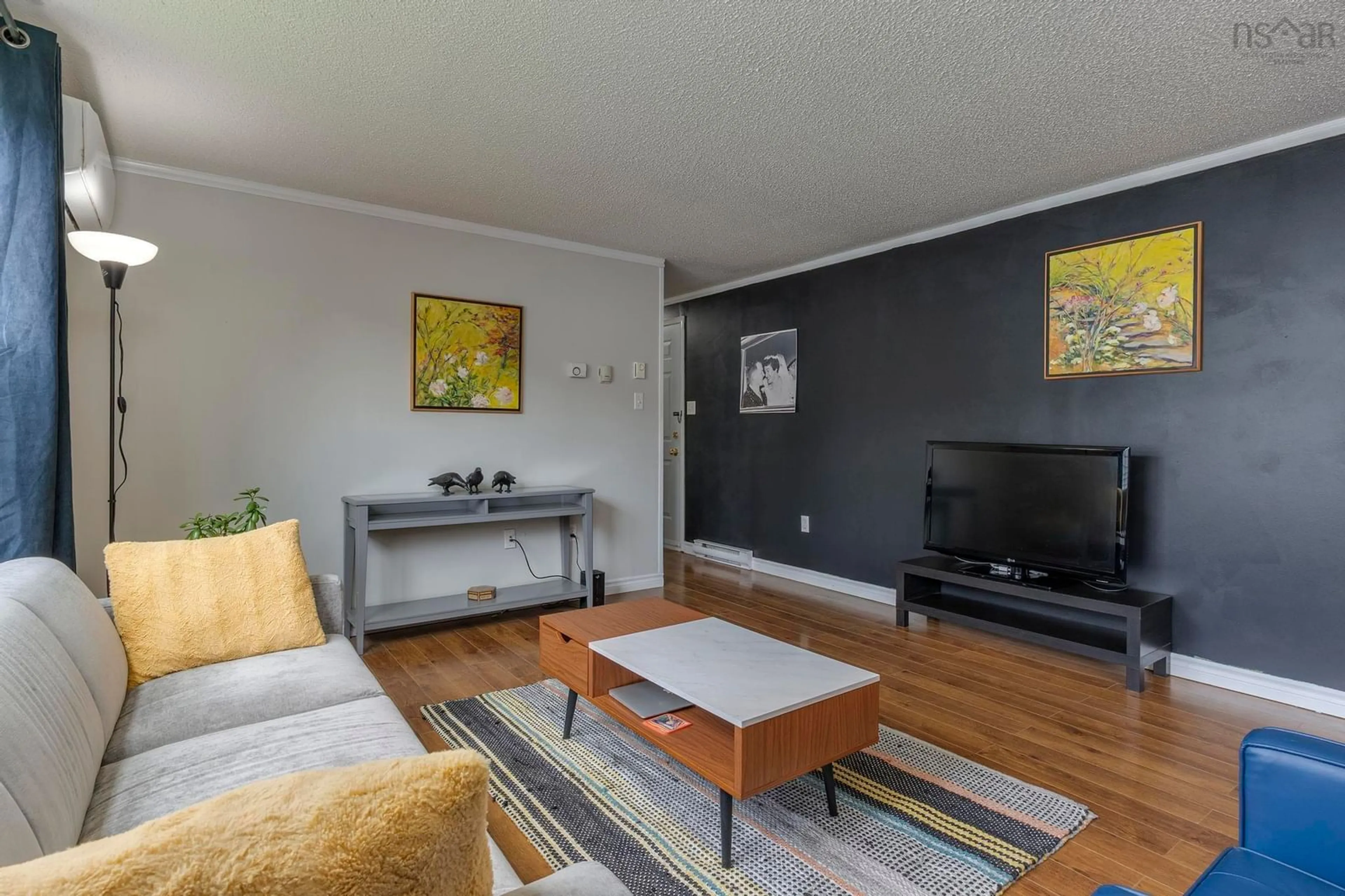 Living room with furniture, wood/laminate floor for 53 Broadway St, Lakeside Nova Scotia B3T 1B1