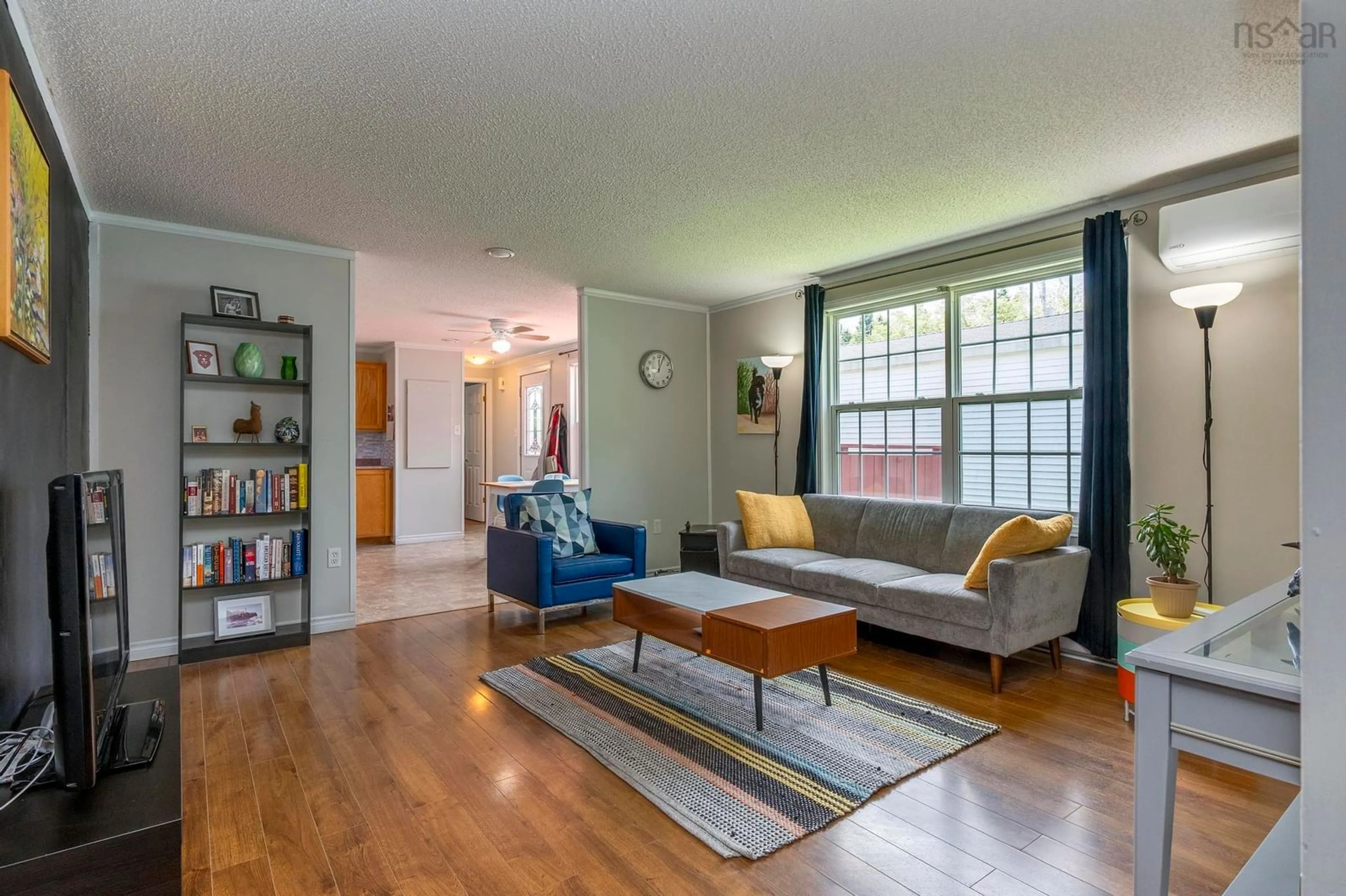Living room with furniture, wood/laminate floor for 53 Broadway St, Lakeside Nova Scotia B3T 1B1