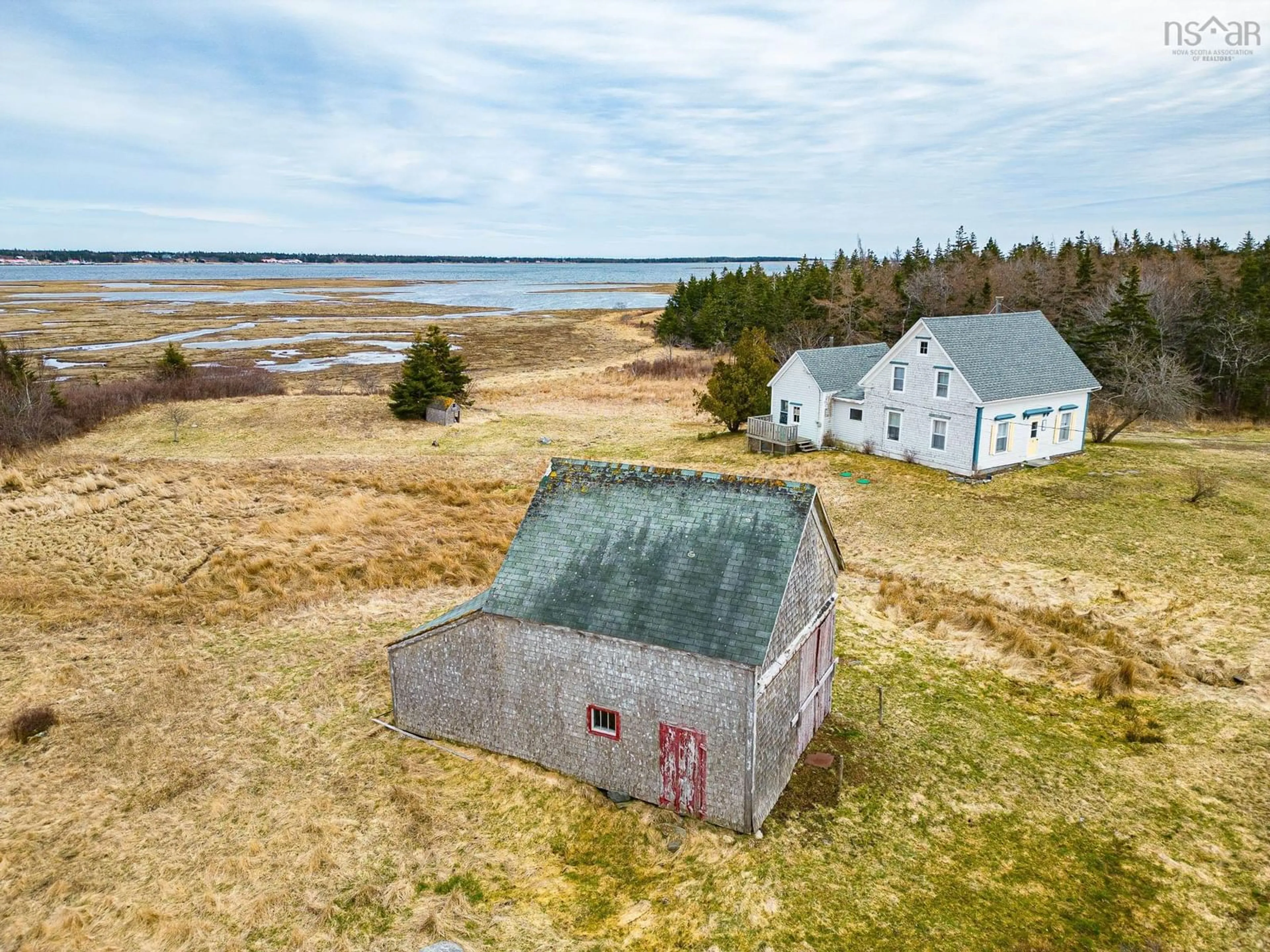 A pic from outside/outdoor area/front of a property/back of a property/a pic from drone, water/lake/river/ocean view for 4847 Shore Rd, North East Harbour Nova Scotia B0T 1W0
