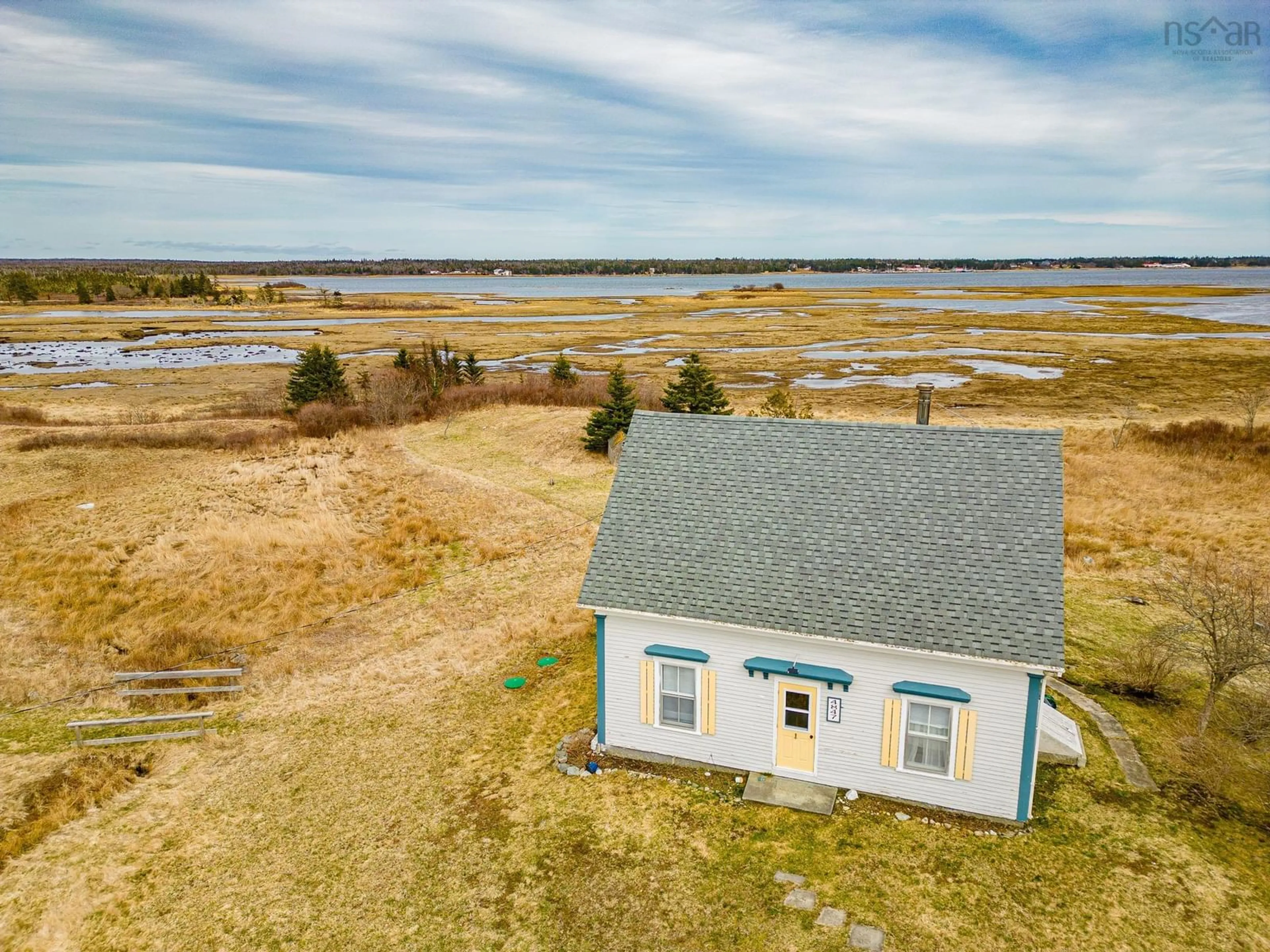 A pic from outside/outdoor area/front of a property/back of a property/a pic from drone, water/lake/river/ocean view for 4847 Shore Rd, North East Harbour Nova Scotia B0T 1W0