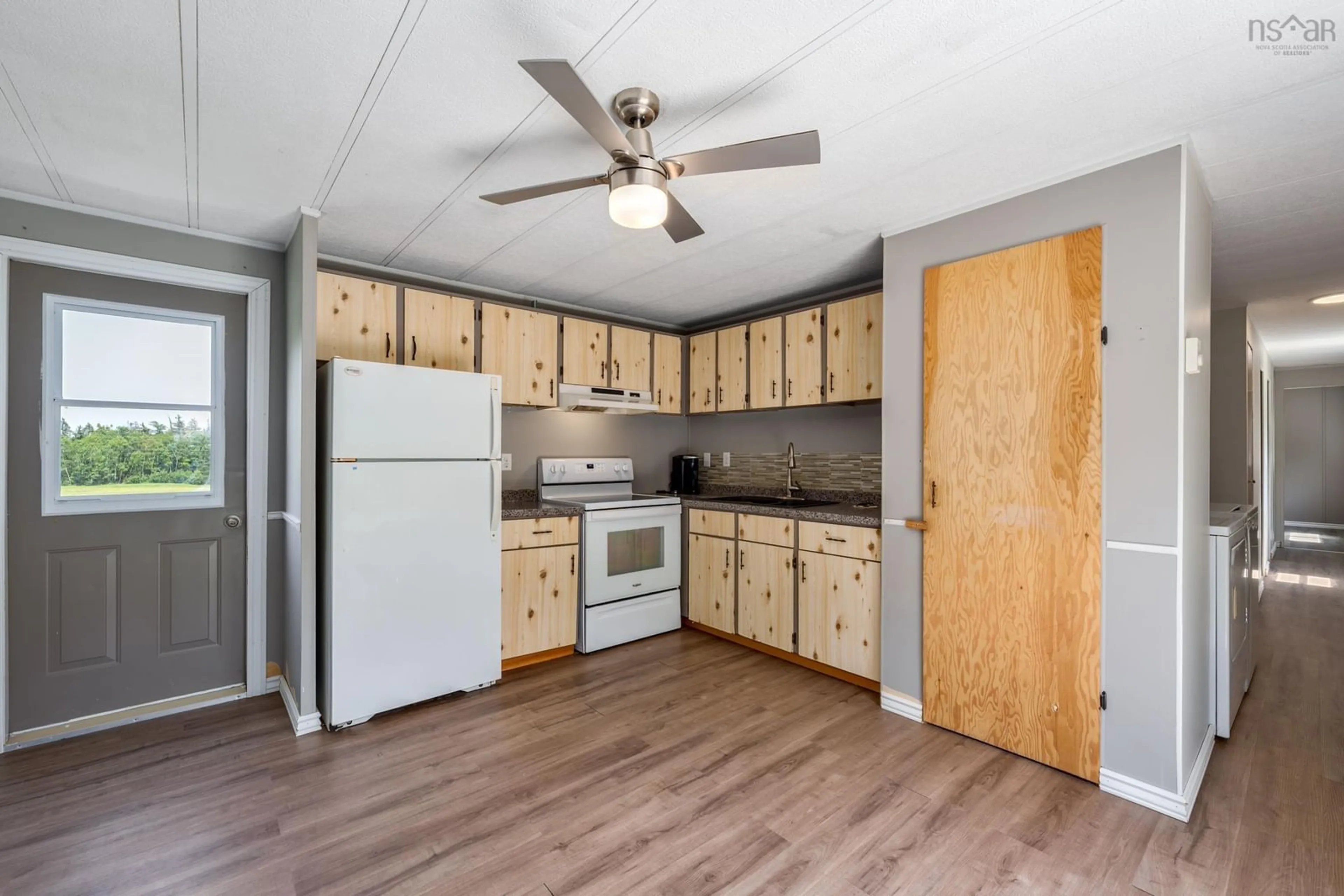 Standard kitchen, wood/laminate floor for 40 Little River Road, Meteghan River Nova Scotia B2W 2L0