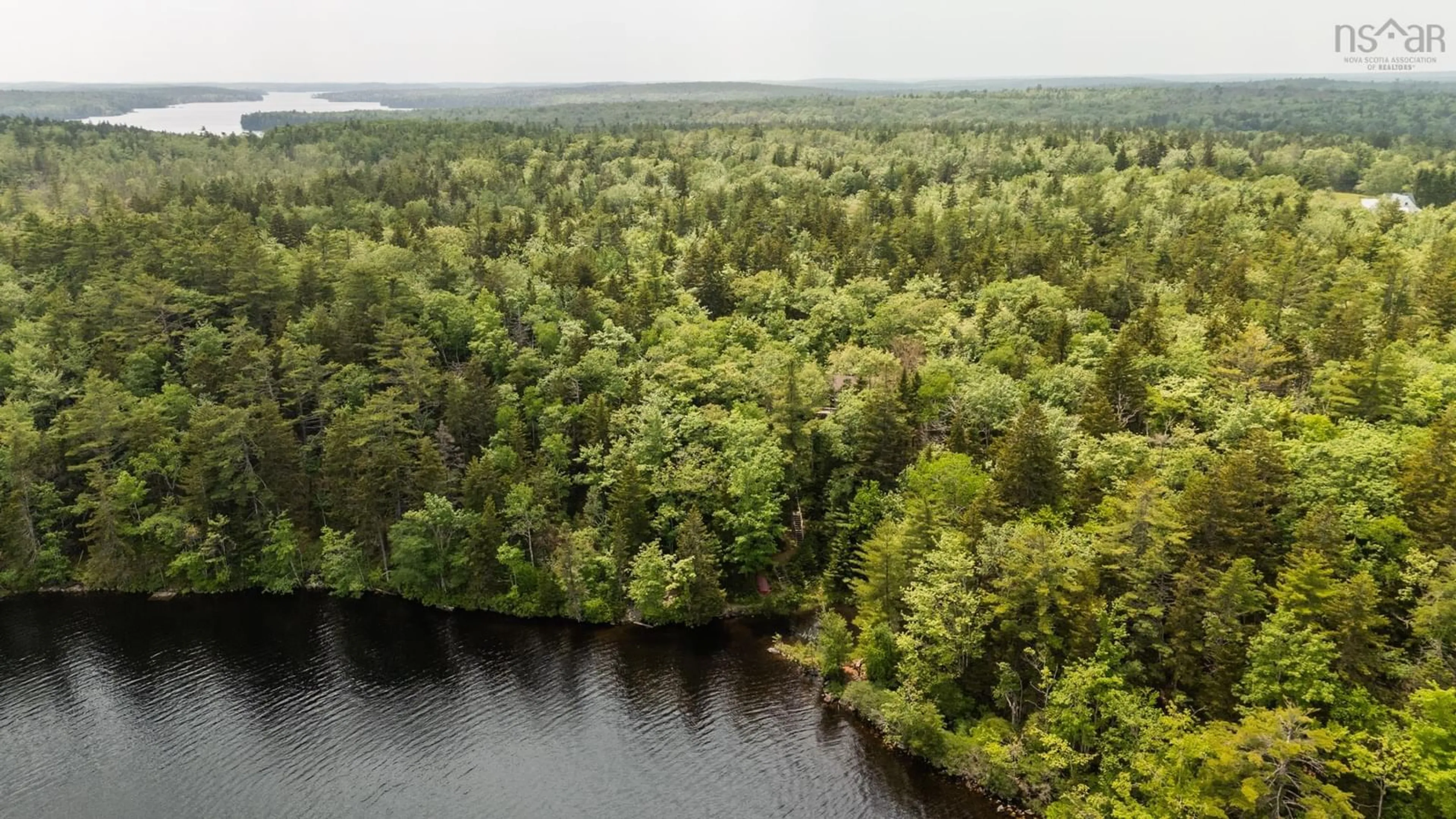 A pic from outside/outdoor area/front of a property/back of a property/a pic from drone, water/lake/river/ocean view for 589 Highway 203, Carleton Nova Scotia B5A 5P9