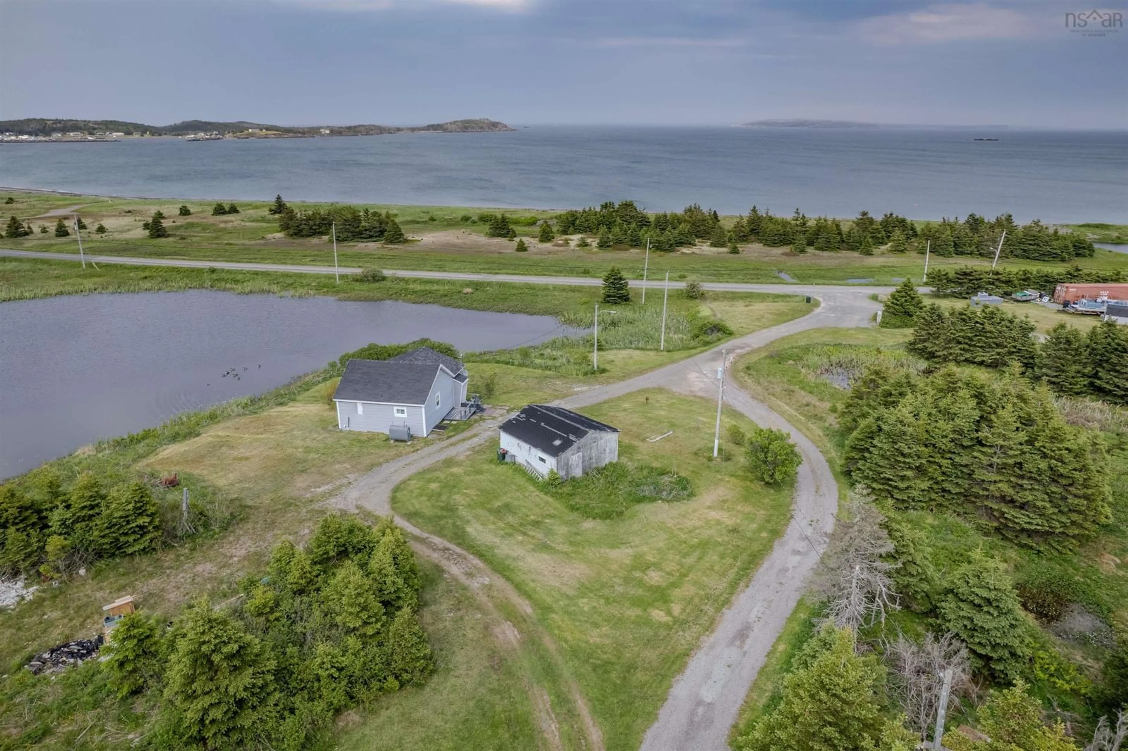 A pic from outside/outdoor area/front of a property/back of a property/a pic from drone, water/lake/river/ocean view for 10 Kenlock Dr, Main-À-Dieu Nova Scotia B1C 1Y4