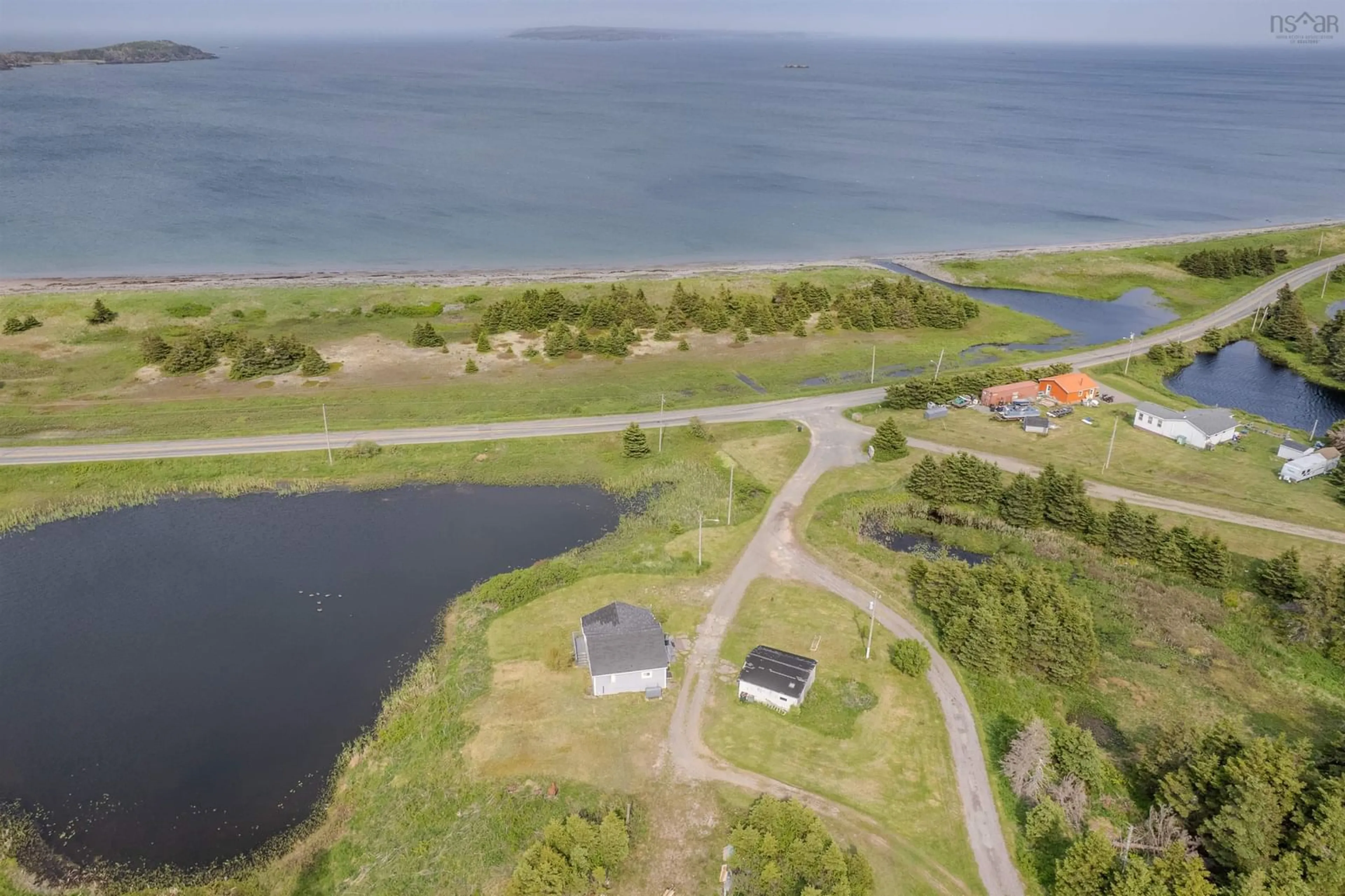 A pic from outside/outdoor area/front of a property/back of a property/a pic from drone, water/lake/river/ocean view for 10 Kenlock Dr, Main-À-Dieu Nova Scotia B1C 1Y4