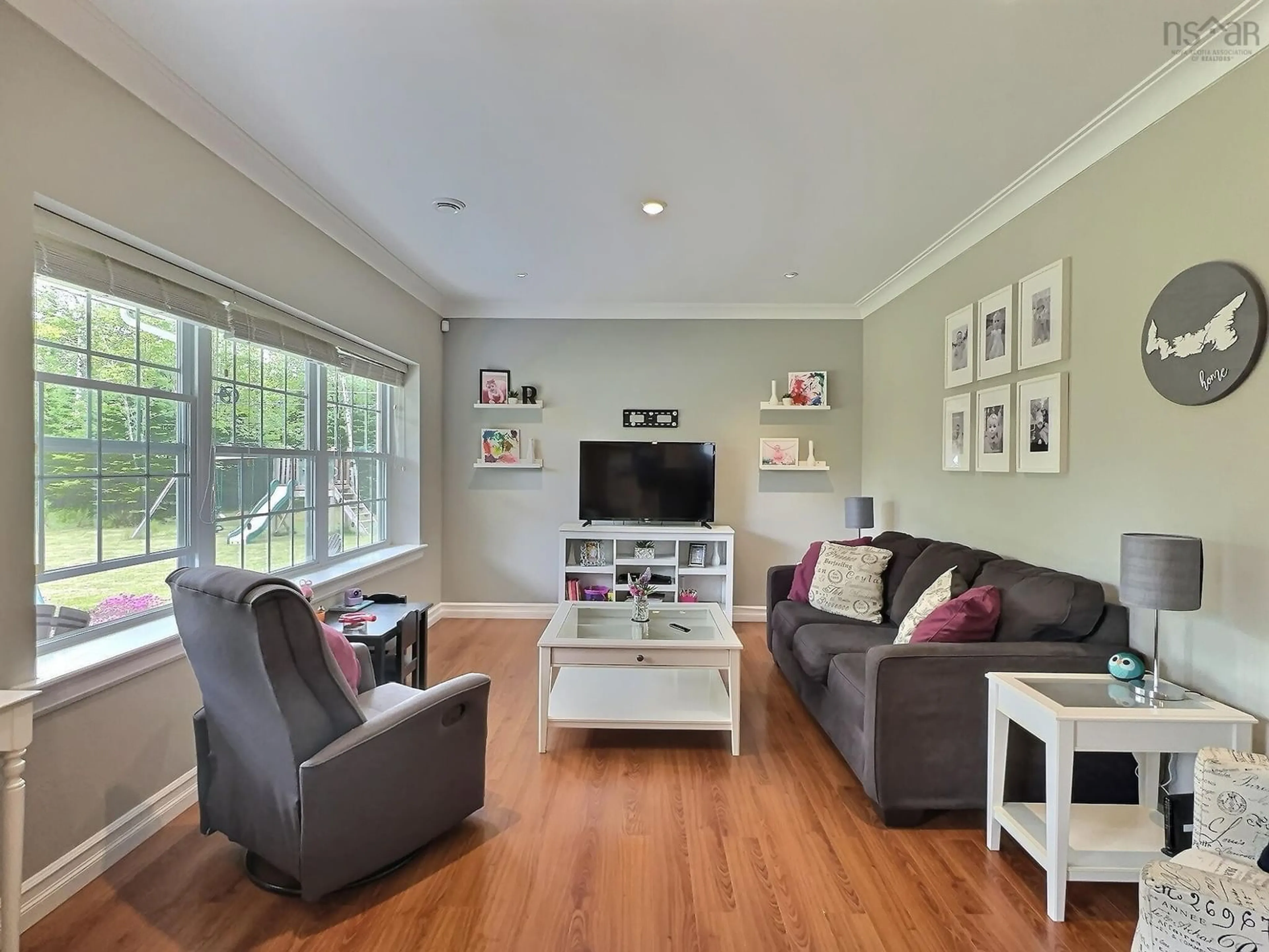 Living room with furniture, wood/laminate floor for 70 Forest Glen Rd, Brookfield Nova Scotia B0N 1C0