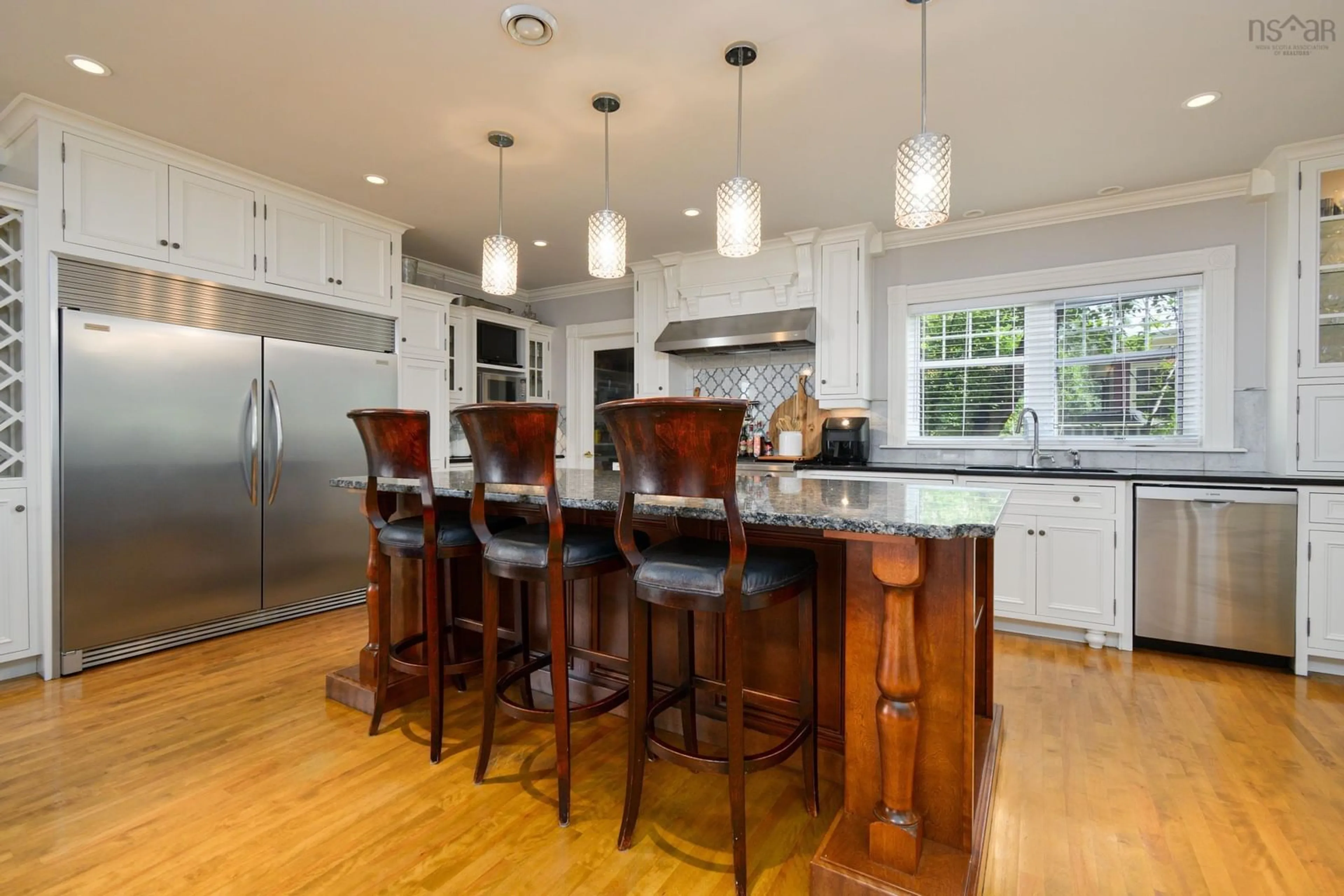 Open concept kitchen, wood/laminate floor for 15 Whitney Ave, Sydney Nova Scotia B1P 4Z6