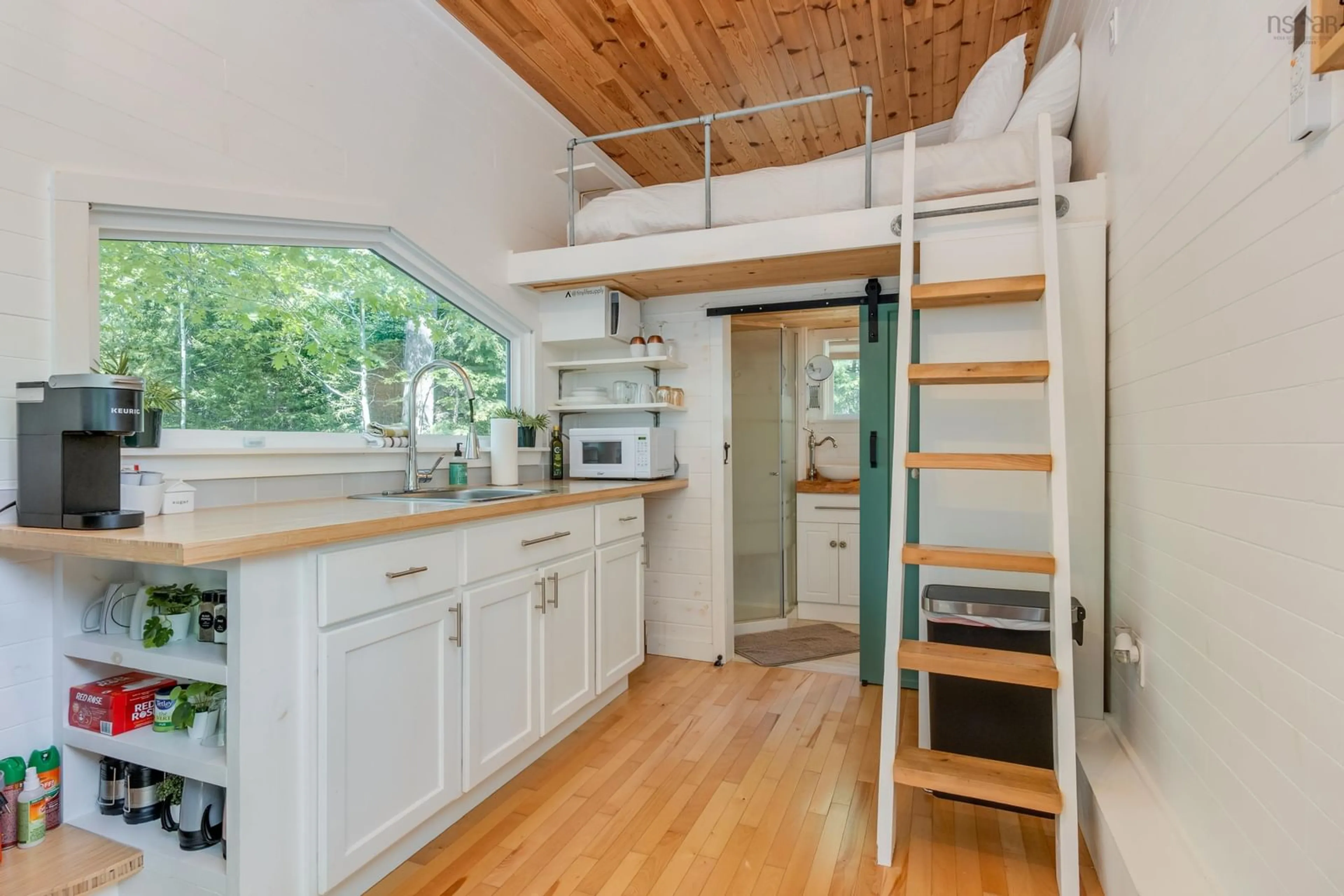 Open concept kitchen, wood/laminate floor for 47 Holters Lane, Chester Grant Nova Scotia B0J 1K0