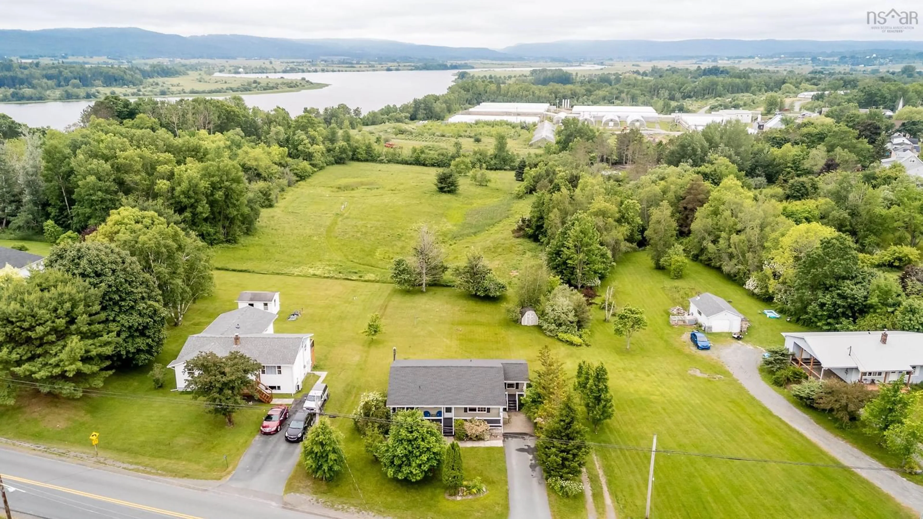A pic from outside/outdoor area/front of a property/back of a property/a pic from drone, water/lake/river/ocean view for 185 Town Rd, Falmouth Nova Scotia B0P 1L0