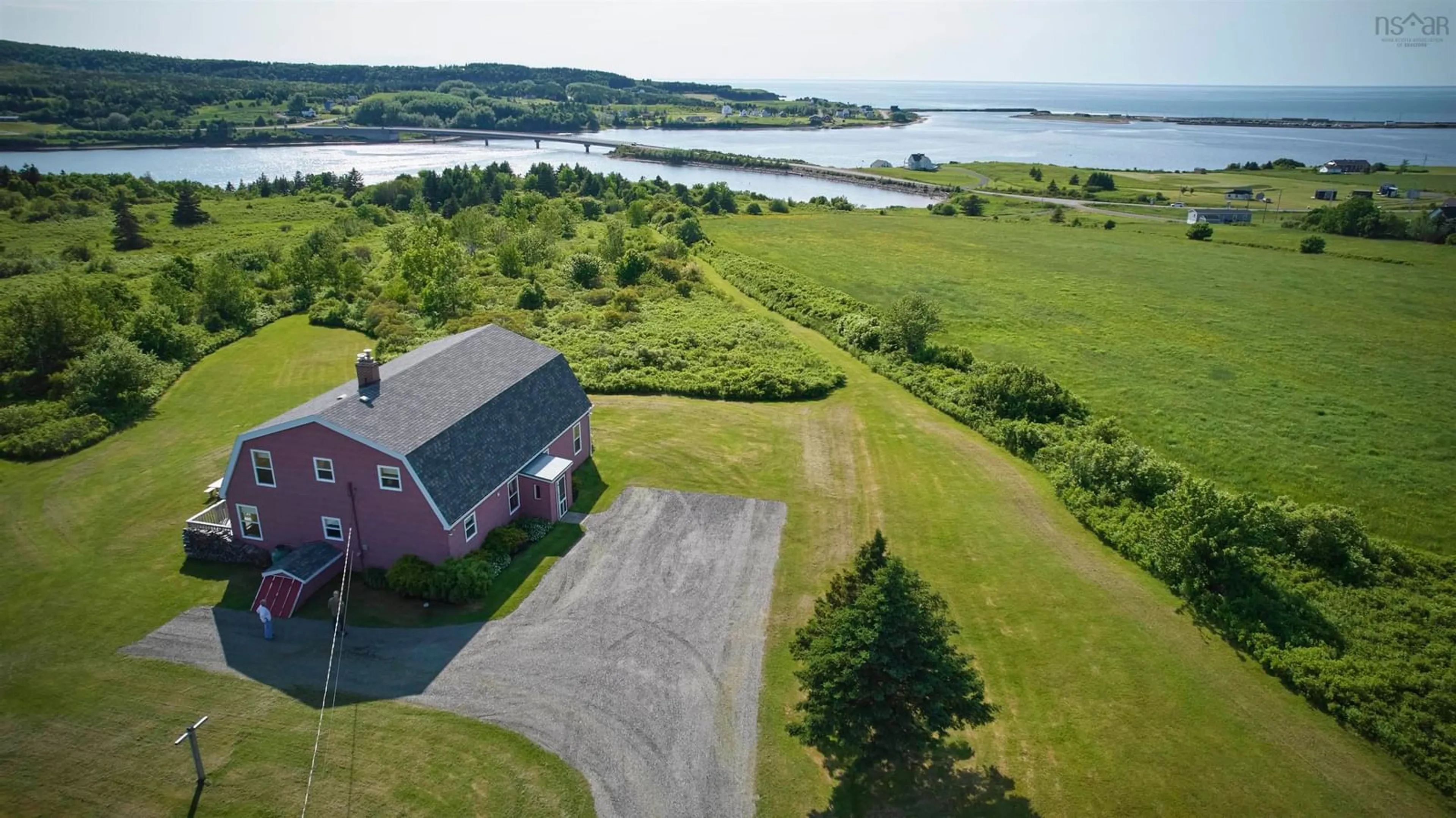A pic from outside/outdoor area/front of a property/back of a property/a pic from drone, water/lake/river/ocean view for 70 South Cormier Rd, Belle Côte Nova Scotia B0E 1C0
