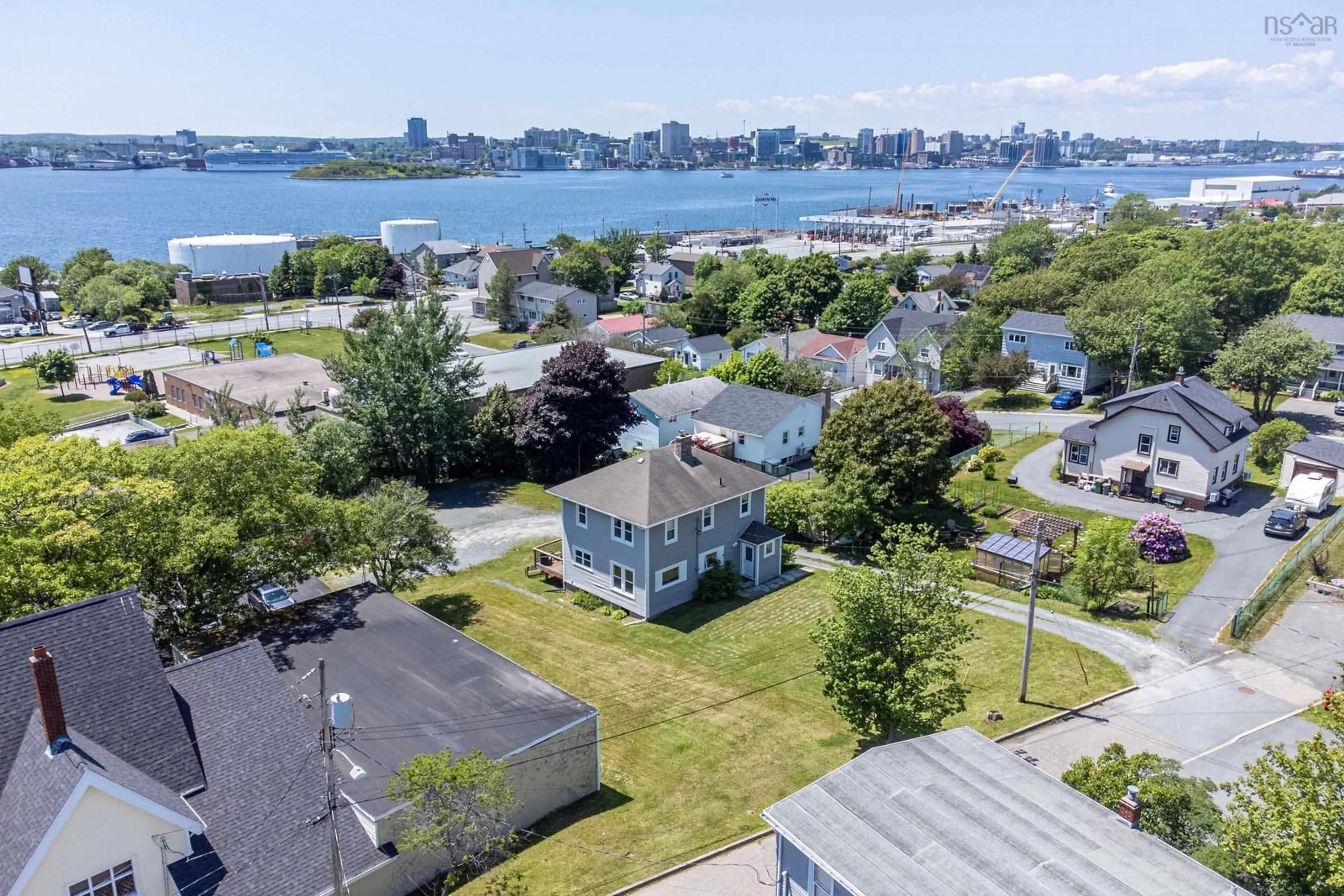 A pic from outside/outdoor area/front of a property/back of a property/a pic from drone, water/lake/river/ocean view for 8 Woodside Ave, Dartmouth Nova Scotia B2W 1B3