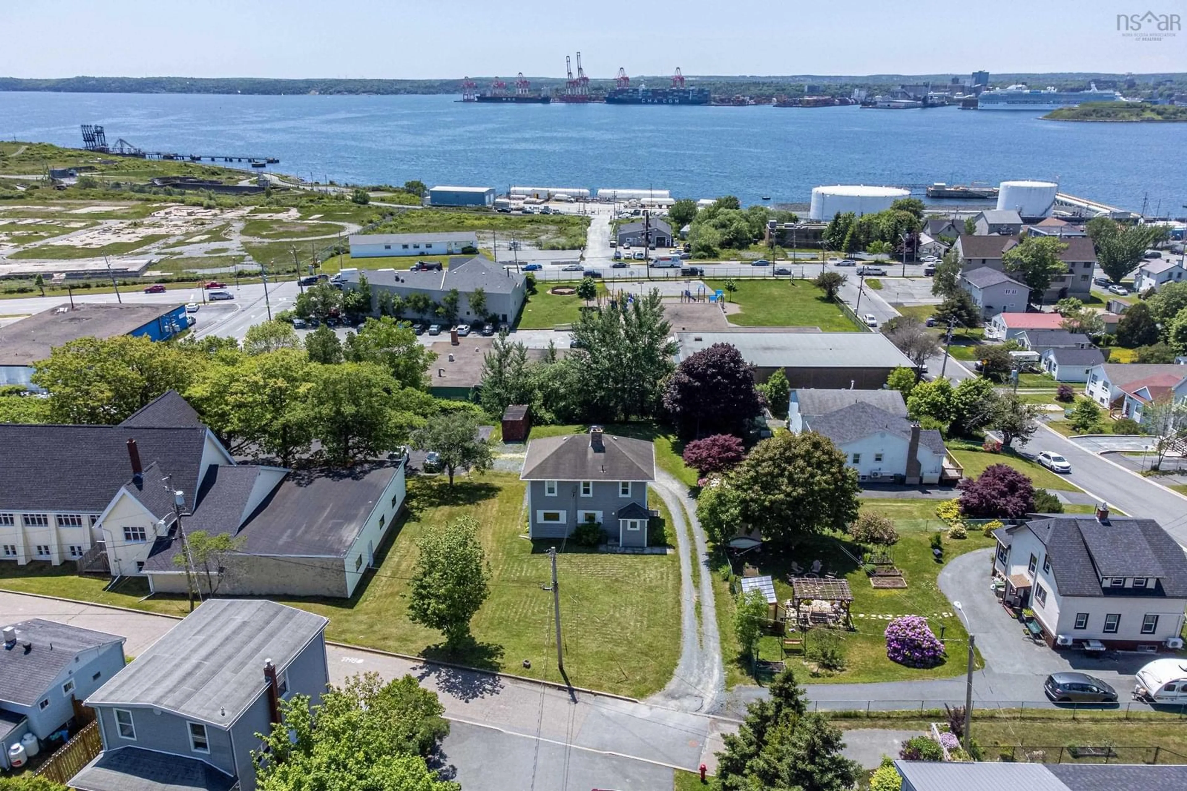 A pic from outside/outdoor area/front of a property/back of a property/a pic from drone, water/lake/river/ocean view for 8 Woodside Ave, Dartmouth Nova Scotia B2W 1B3