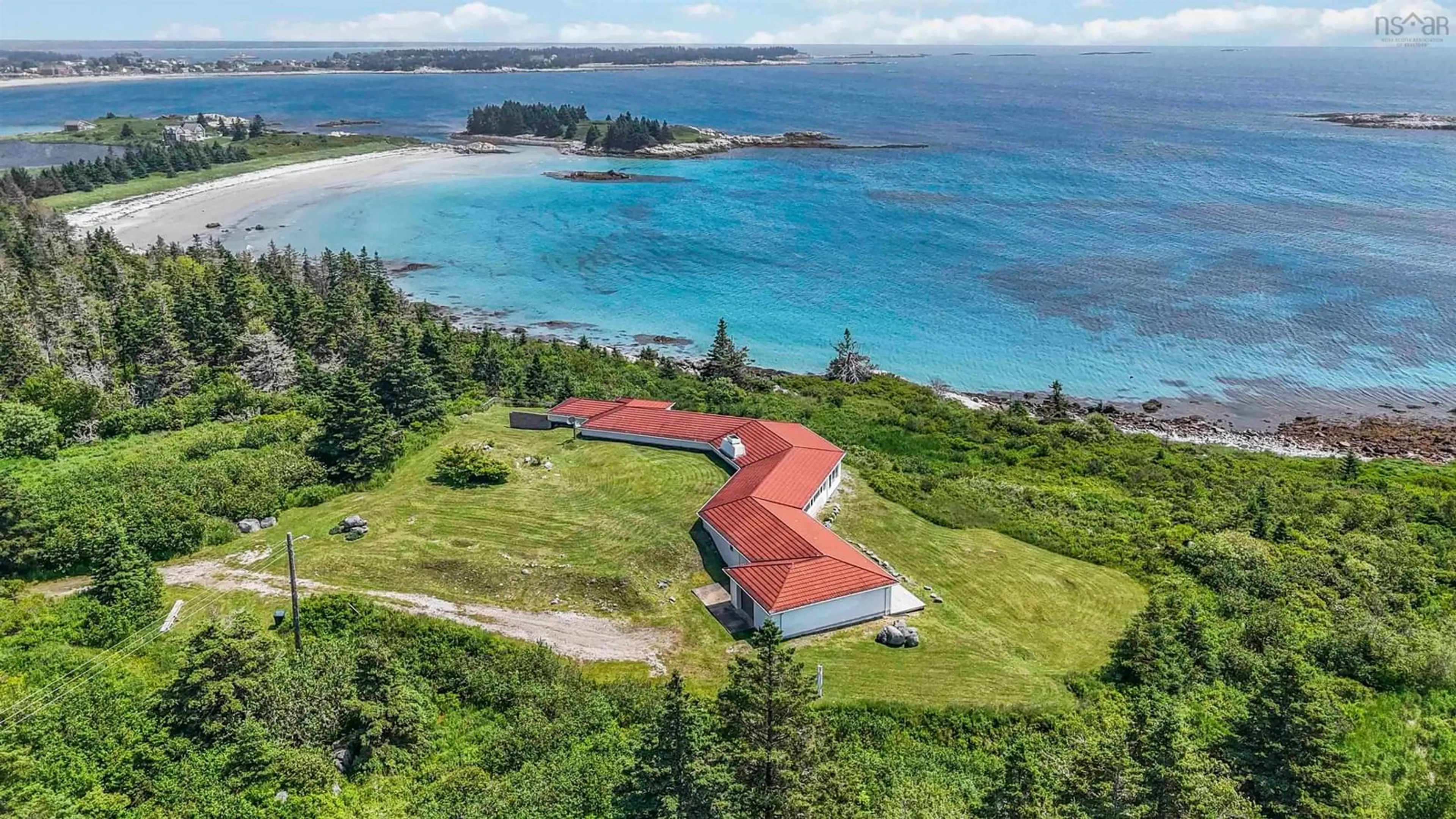 A pic from outside/outdoor area/front of a property/back of a property/a pic from drone, water/lake/river/ocean view for 215 West Head Rd, Western Head Nova Scotia B0T 1L0