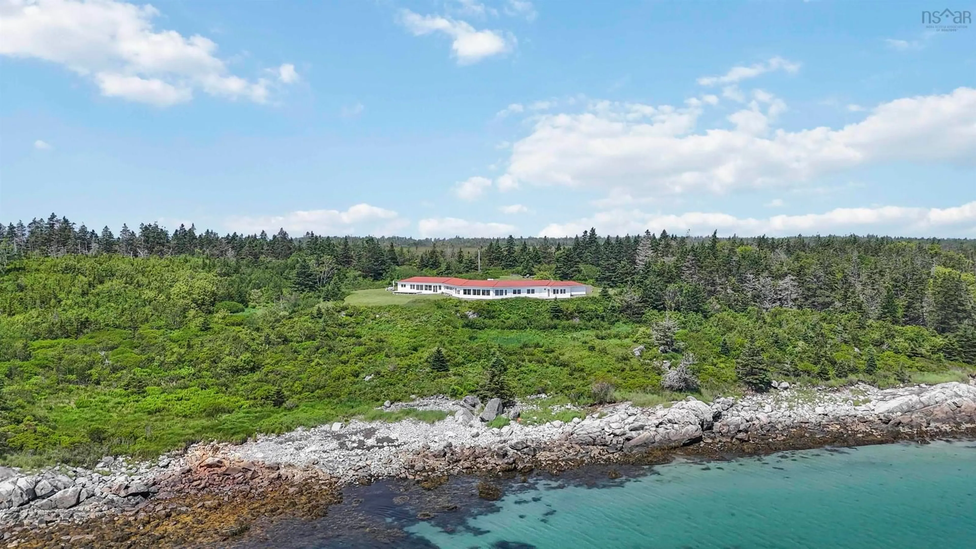 A pic from outside/outdoor area/front of a property/back of a property/a pic from drone, water/lake/river/ocean view for 215 West Head Rd, Western Head Nova Scotia B0T 1L0