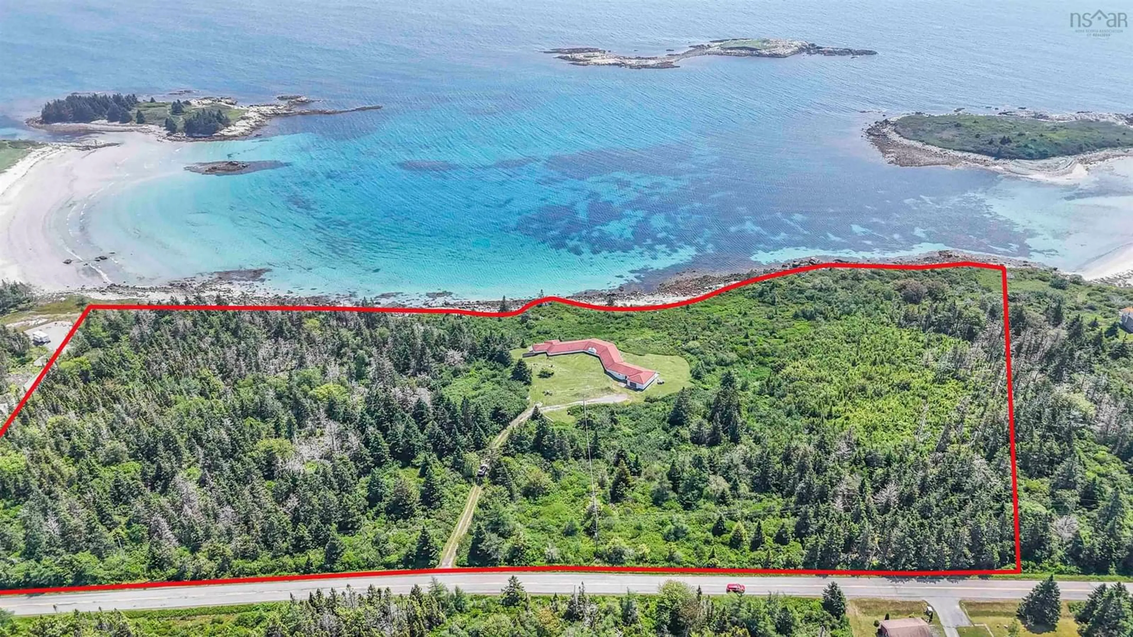 A pic from outside/outdoor area/front of a property/back of a property/a pic from drone, water/lake/river/ocean view for 215 West Head Rd, Western Head Nova Scotia B0T 1L0