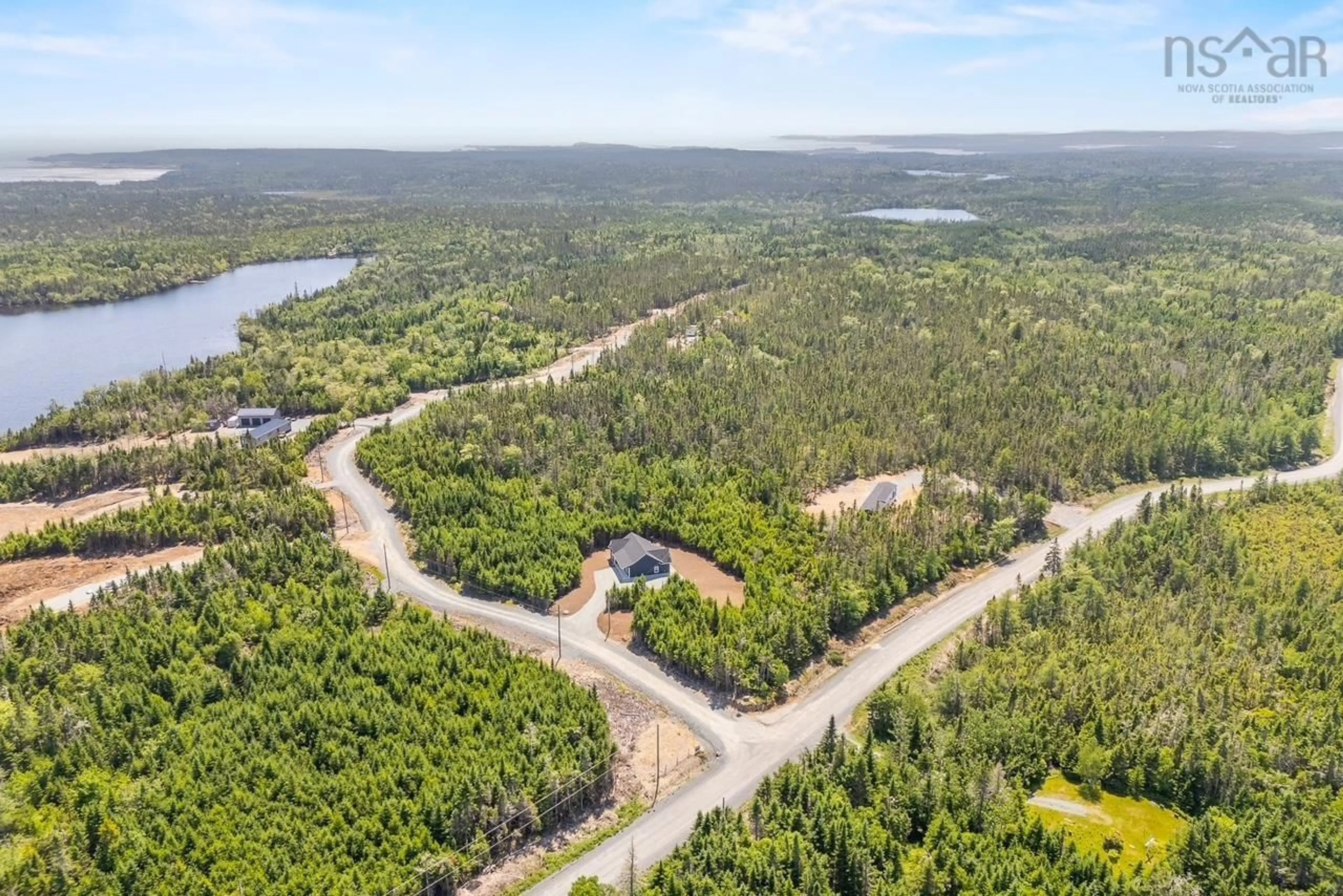 A pic from outside/outdoor area/front of a property/back of a property/a pic from drone, water/lake/river/ocean view for 11 Dark Pond Lane, West Petpeswick Nova Scotia B0J 2L0