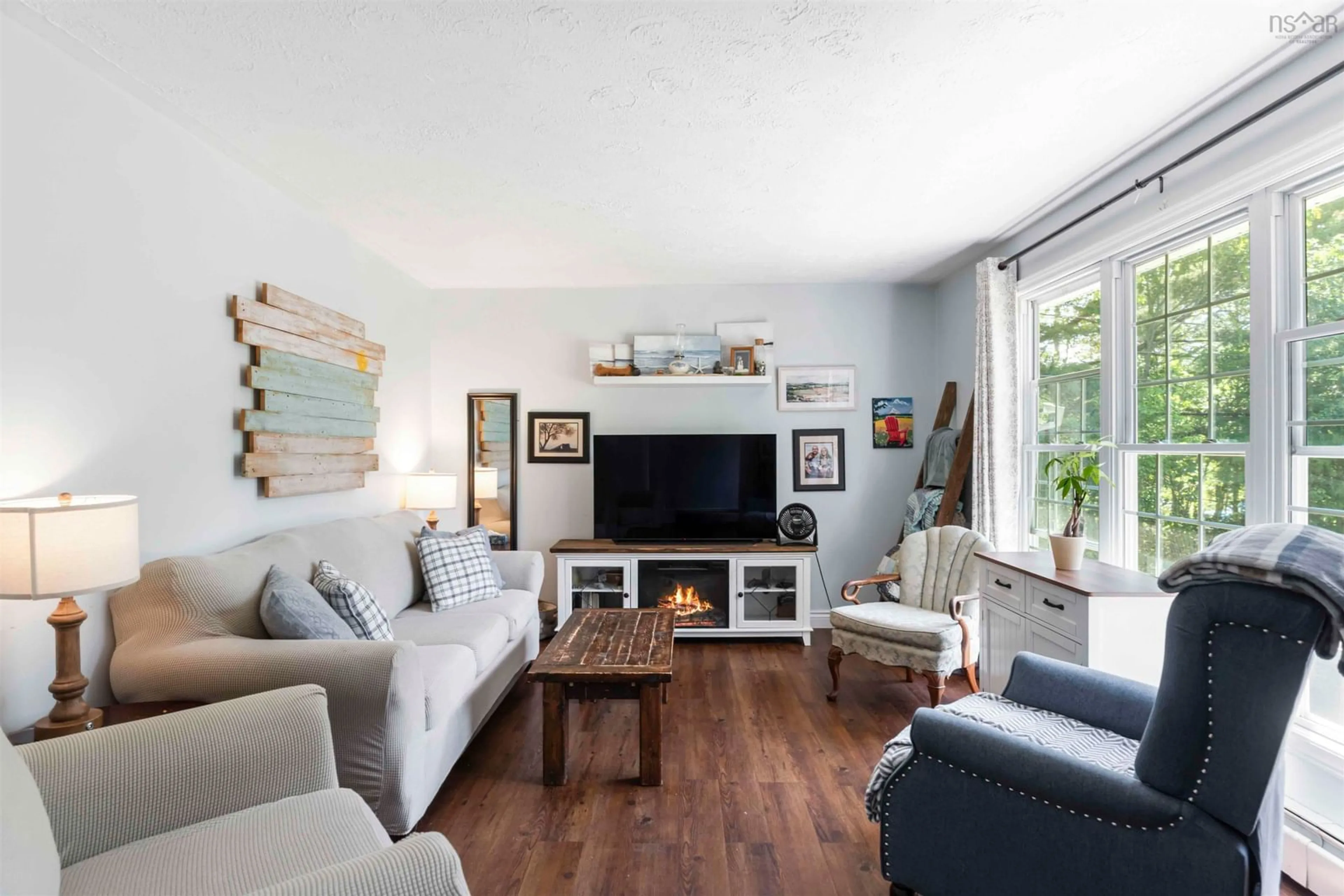 Living room with furniture, wood/laminate floor for 165 Hall Rd, South Greenwood Nova Scotia B0P 1R0