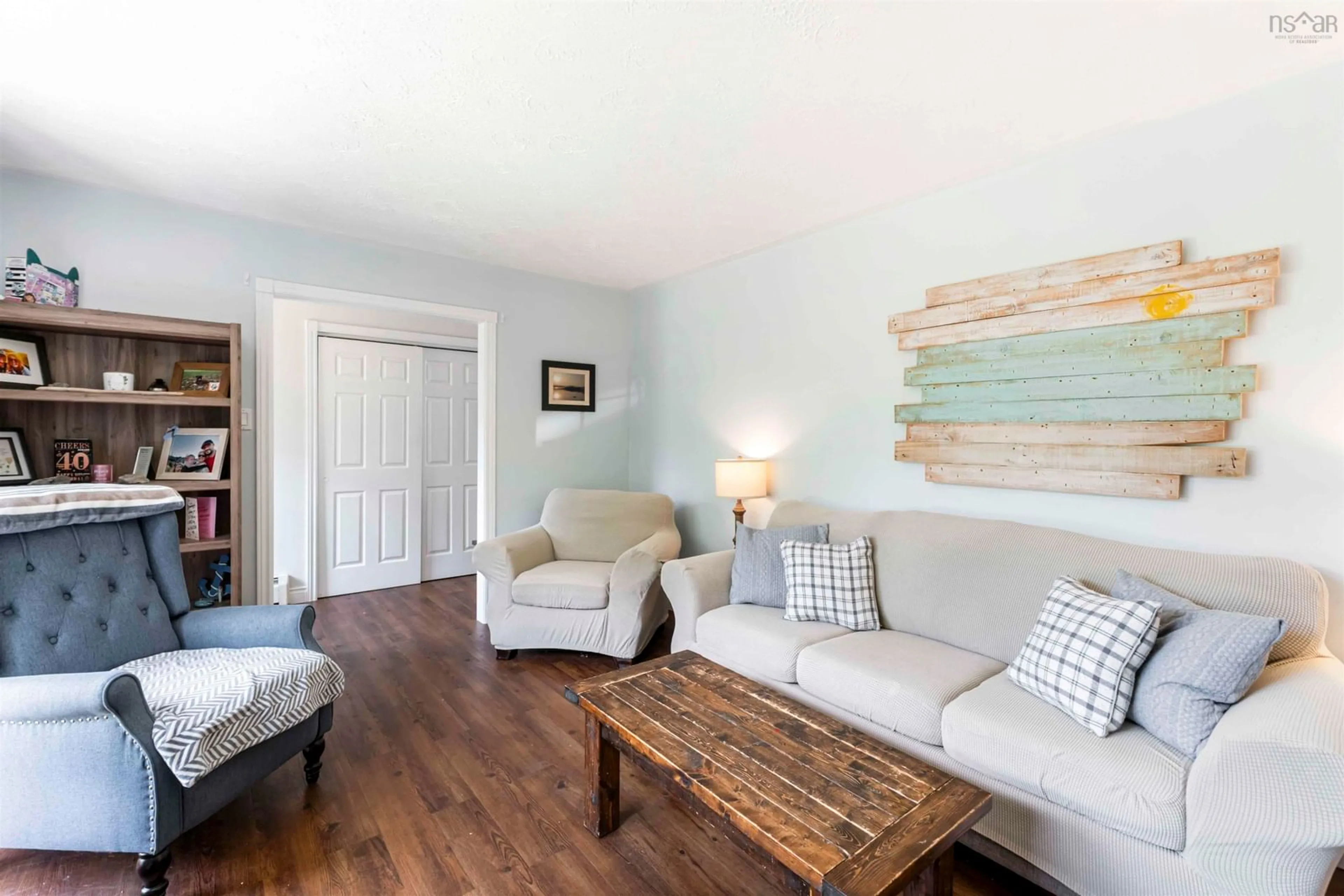 Living room with furniture, wood/laminate floor for 165 Hall Rd, South Greenwood Nova Scotia B0P 1R0