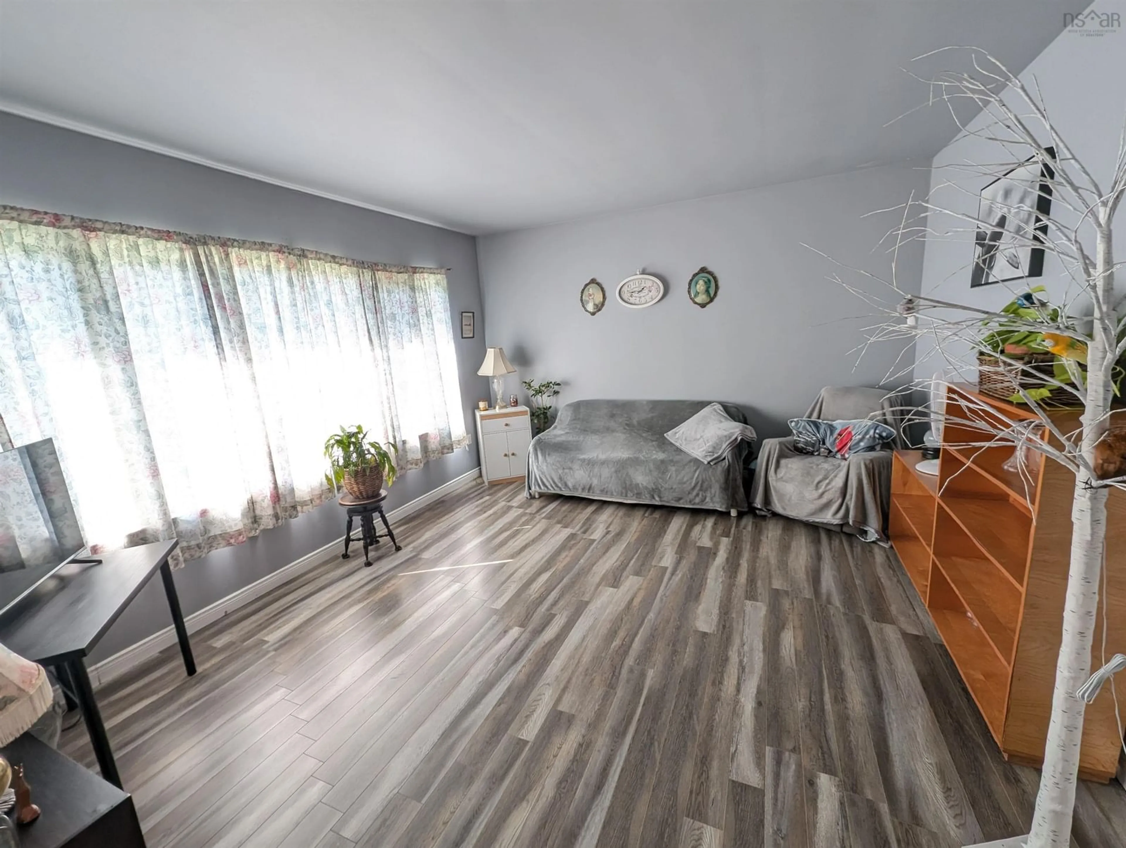 Living room with furniture, wood/laminate floor for 1335 Highway 2, Lantz Nova Scotia B2S 1Z2