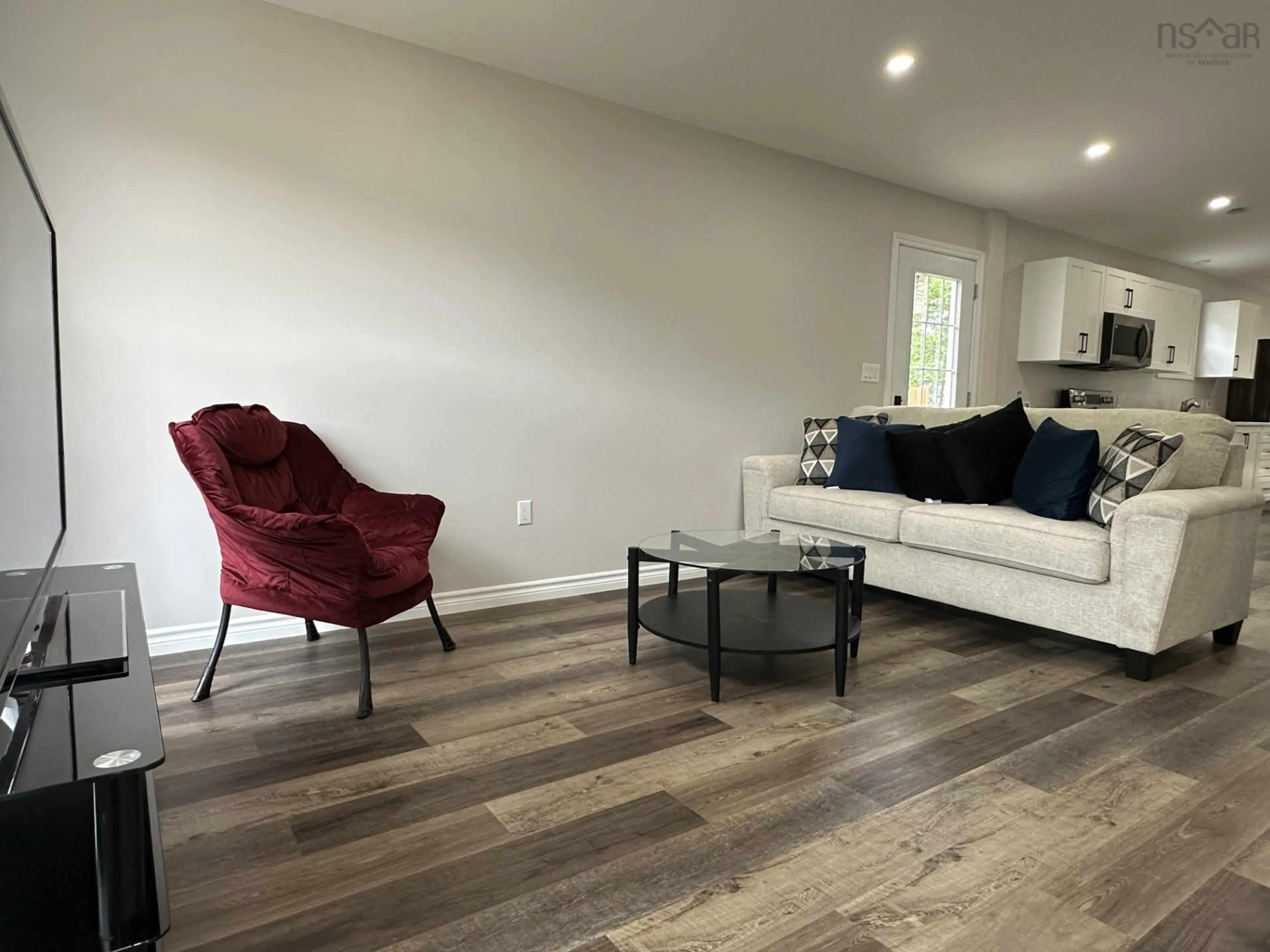 Living room with furniture, wood/laminate floor for 59 Fourteenth St, Trenton Nova Scotia B0K 1X0