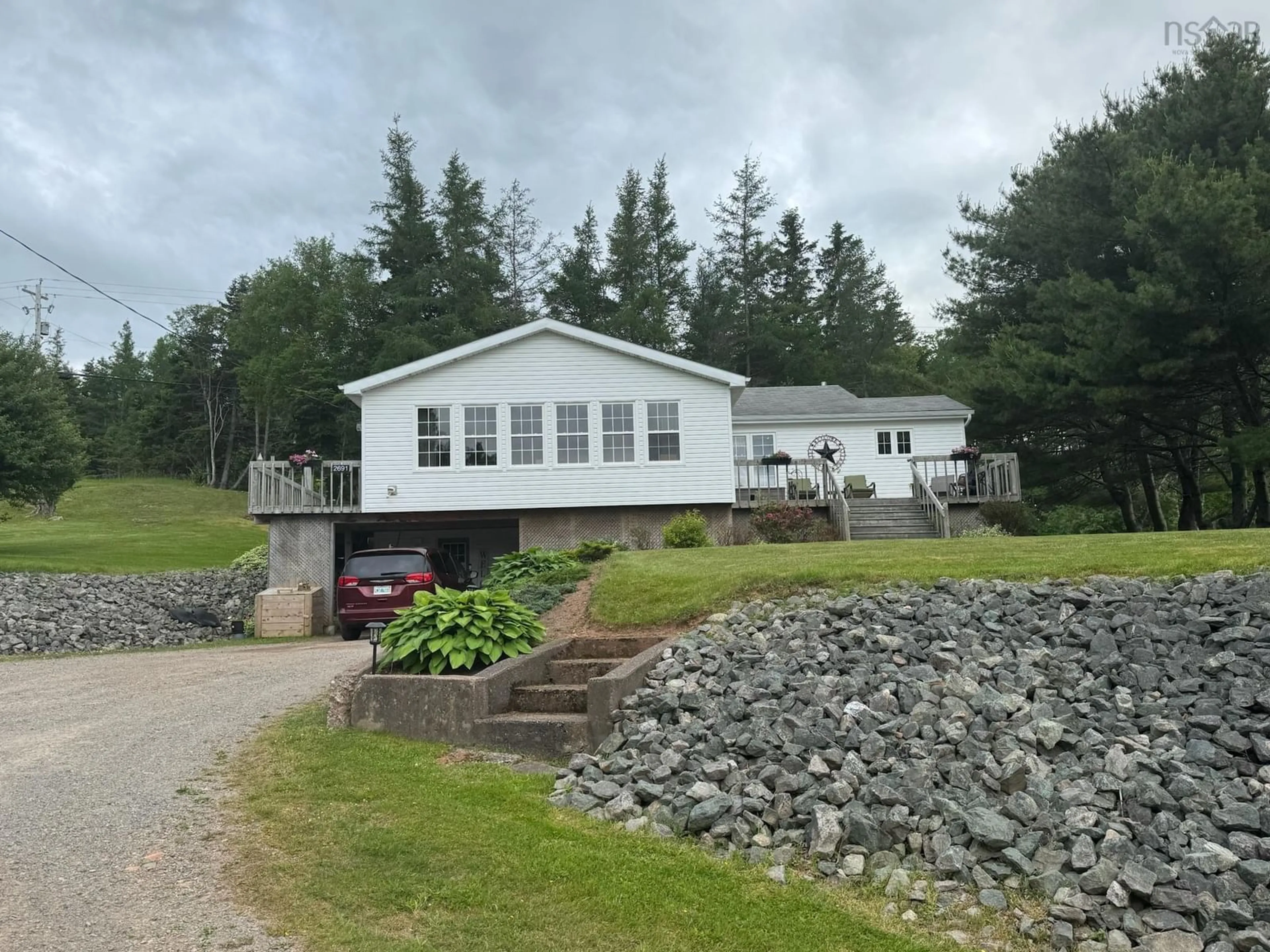 A pic from outside/outdoor area/front of a property/back of a property/a pic from drone, water/lake/river/ocean view for 2691 East Margaree Rd, Margaree Forks Nova Scotia B0E 2A0