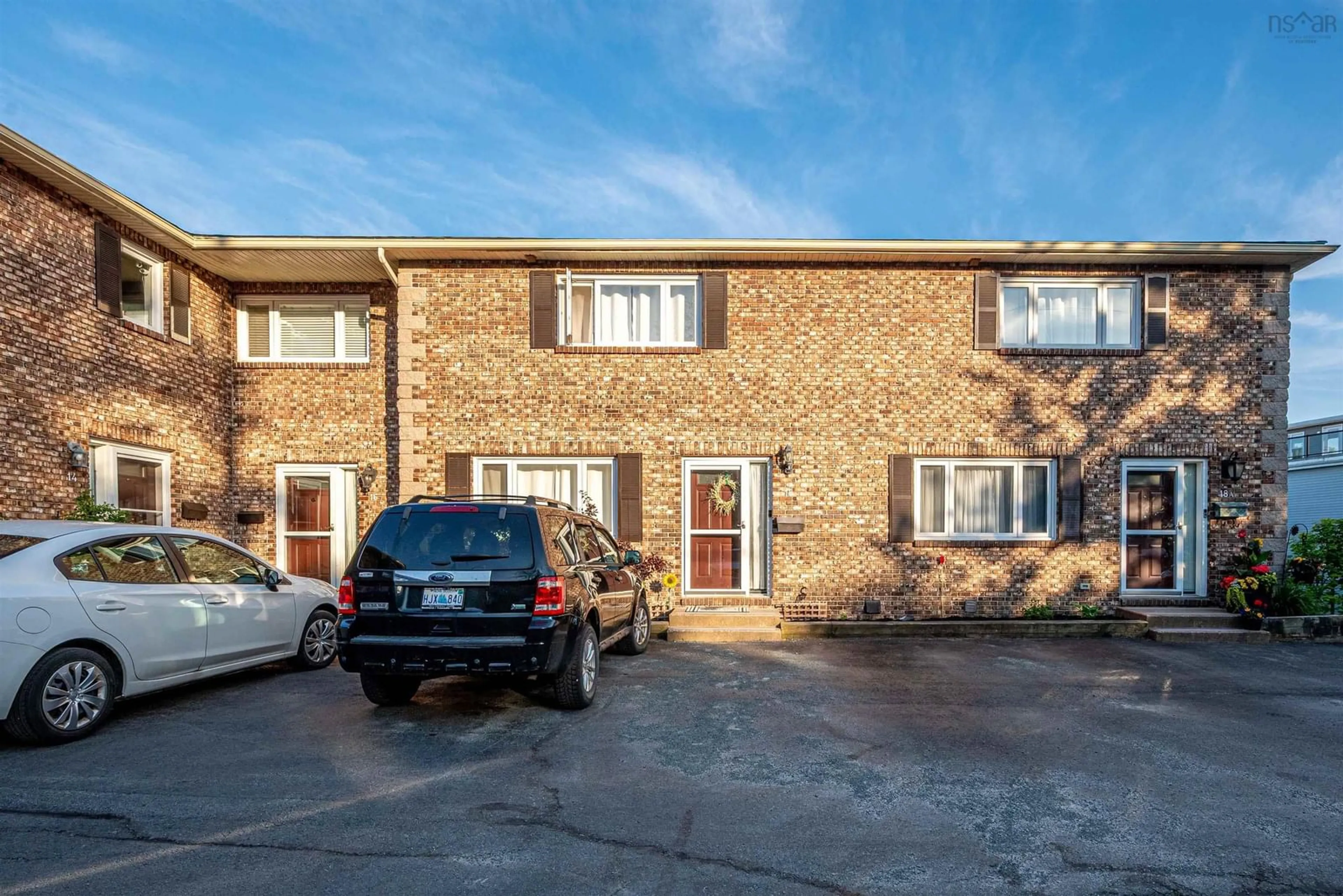 A pic from outside/outdoor area/front of a property/back of a property/a pic from drone, street for 18 Pioneer Ave #2, Halifax Nova Scotia B3M 1V2