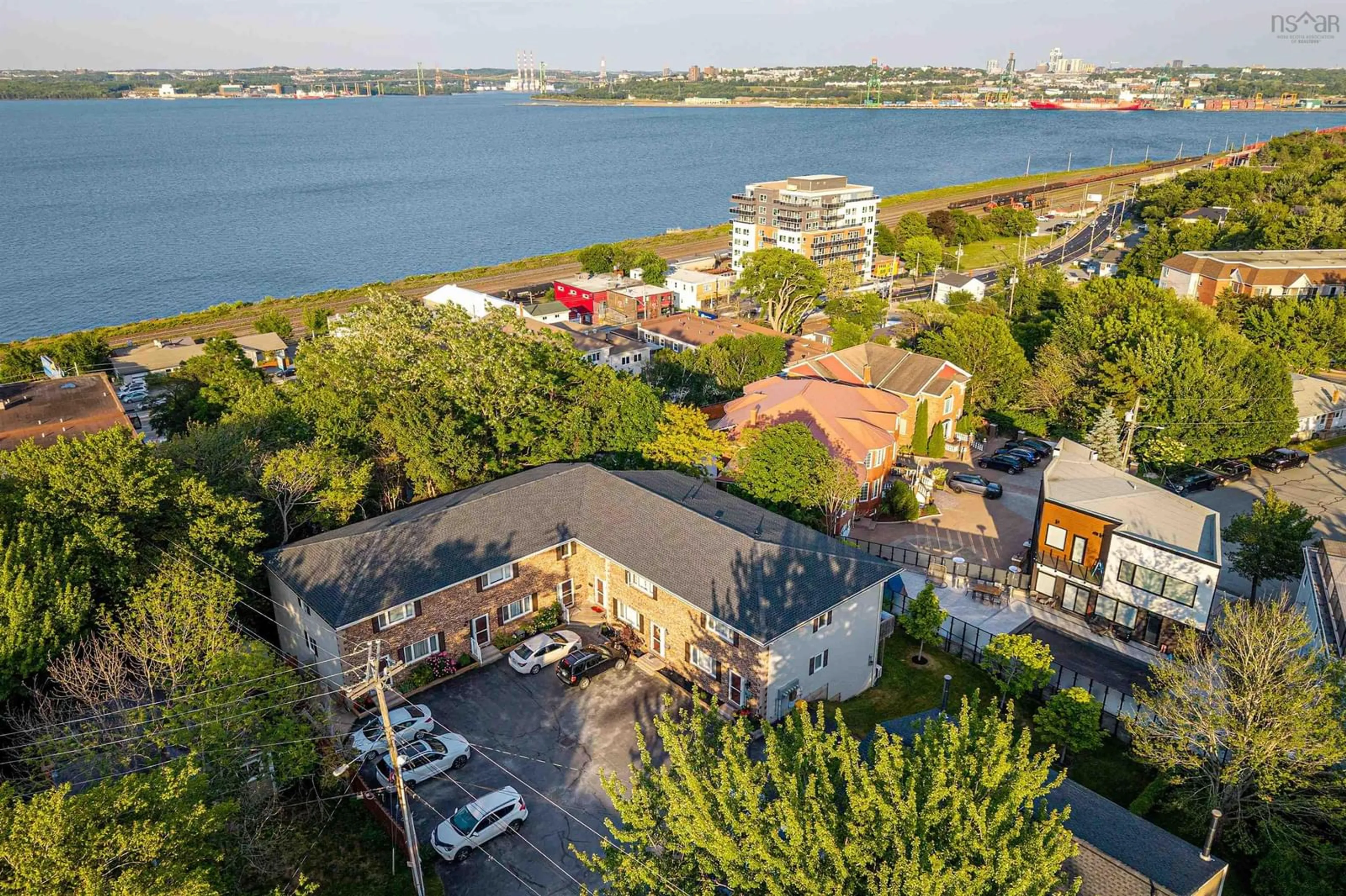 A pic from outside/outdoor area/front of a property/back of a property/a pic from drone, water/lake/river/ocean view for 18 Pioneer Ave #2, Halifax Nova Scotia B3M 1V2