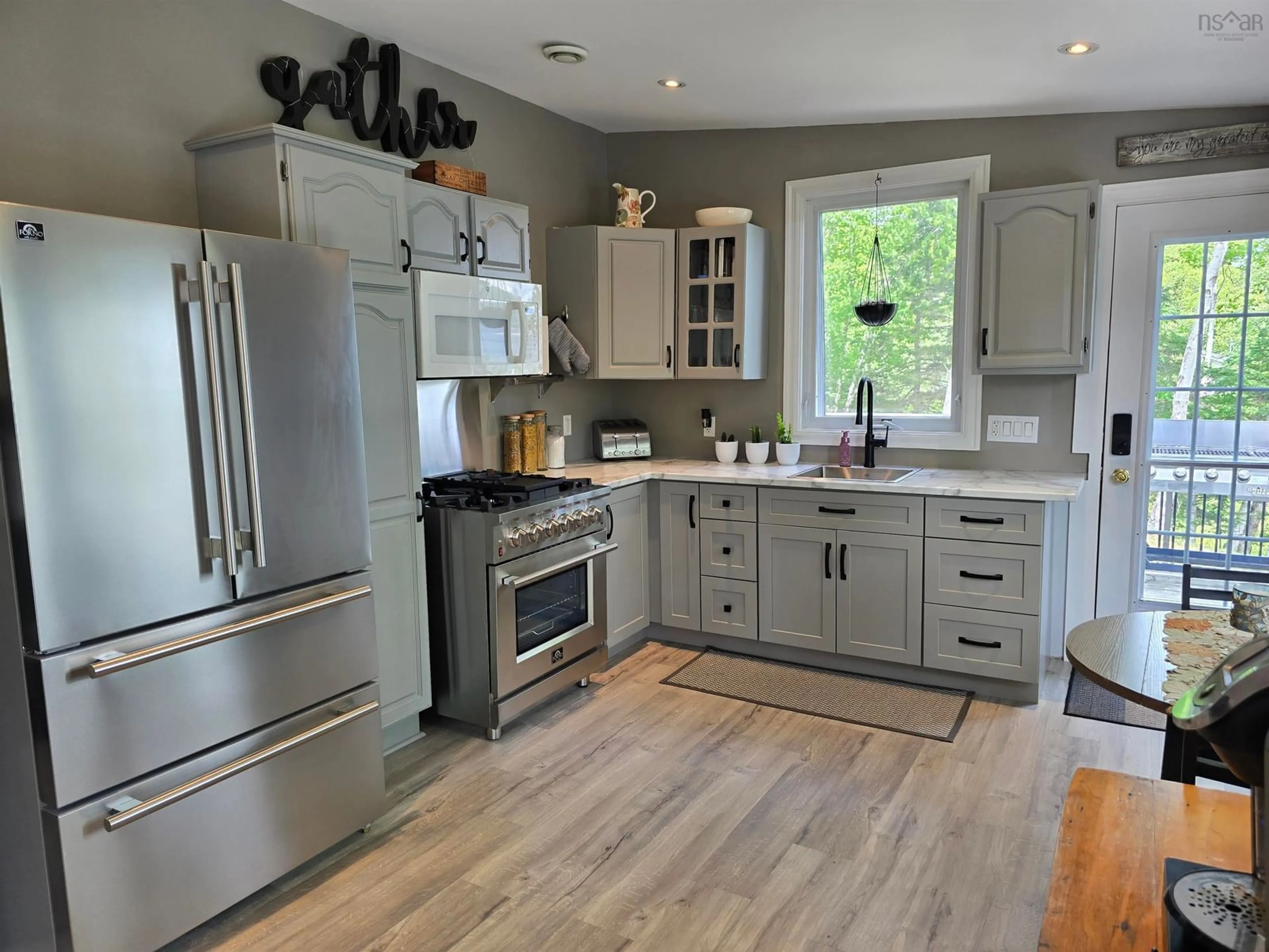 Open concept kitchen, unknown for 21 Macgillivery Lane, North Side East Bay Nova Scotia B1J 1H5