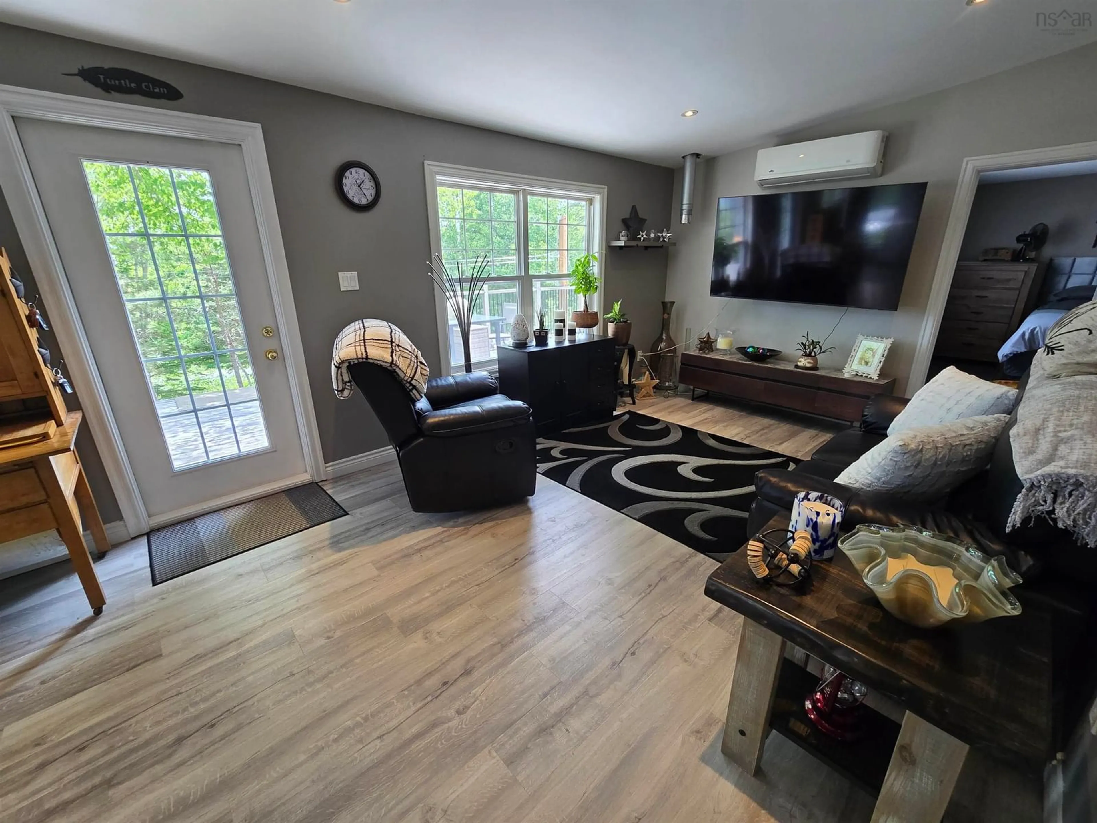 Living room with furniture, wood/laminate floor for 21 Macgillivery Lane, North Side East Bay Nova Scotia B1J 1H5