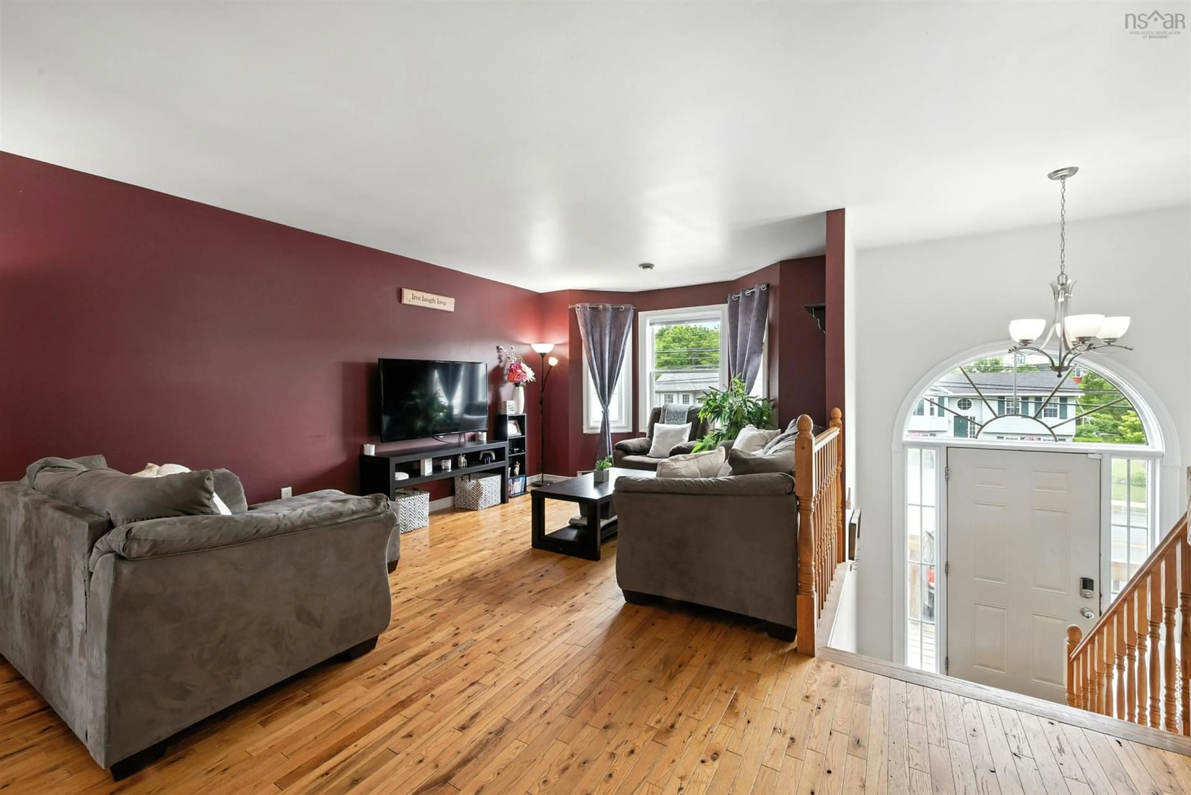 Living room with furniture, wood/laminate floor for 1225 Sackville Dr, Middle Sackville Nova Scotia B4E 3G1