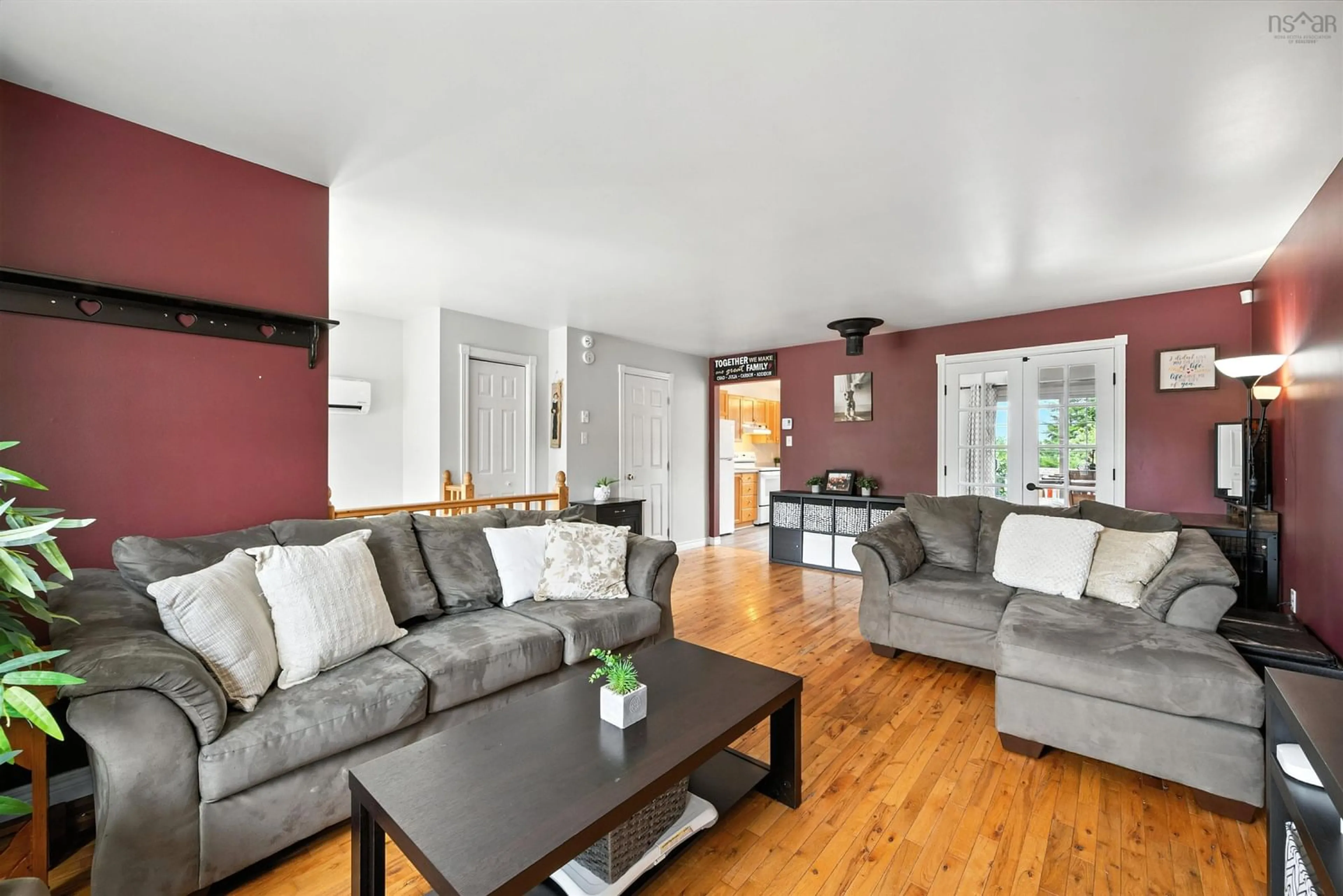 Living room with furniture, wood/laminate floor for 1225 Sackville Dr, Middle Sackville Nova Scotia B4E 3G1