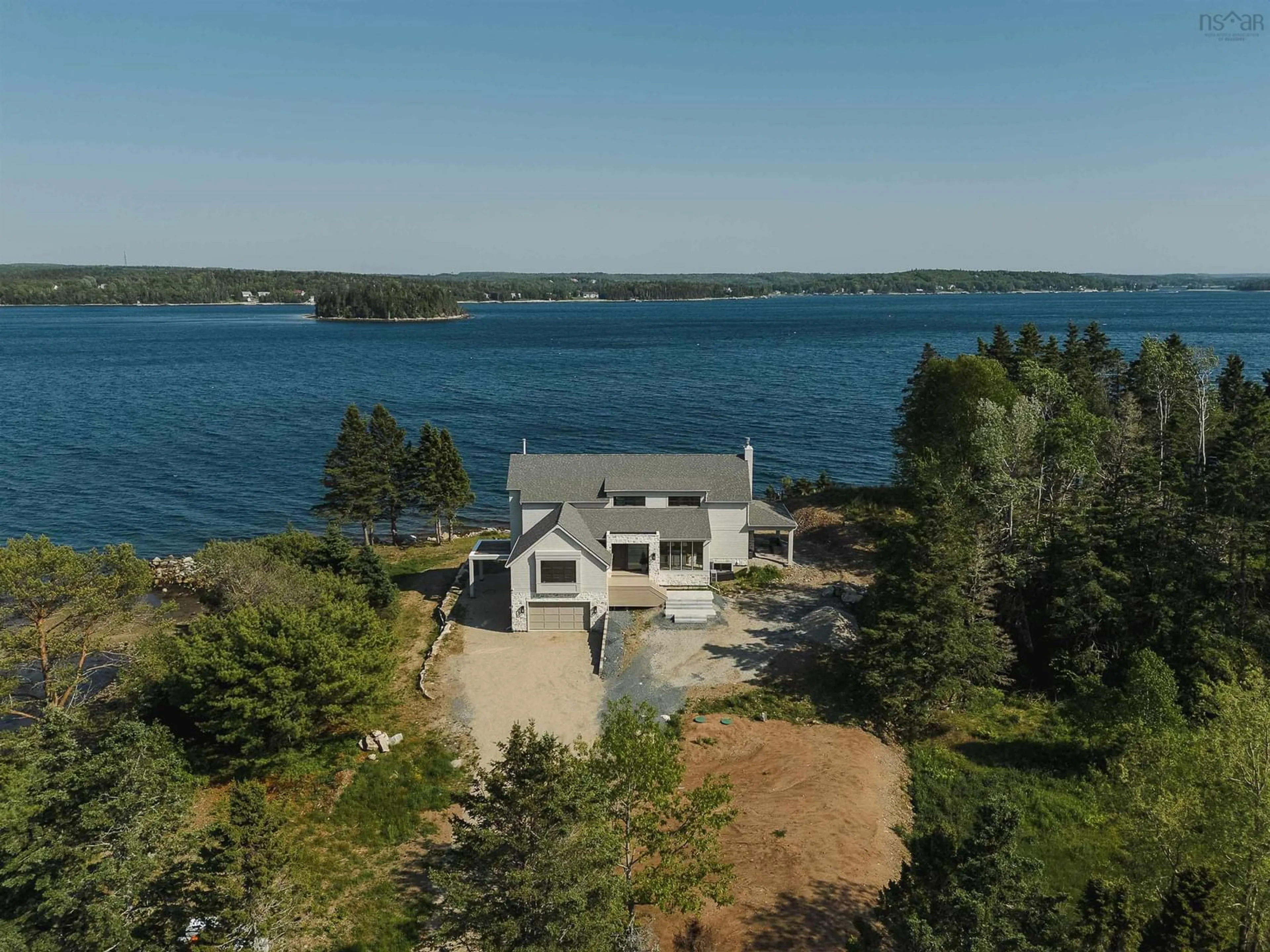 A pic from outside/outdoor area/front of a property/back of a property/a pic from drone, water/lake/river/ocean view for 7026 St Margarets Bay Rd, Boutiliers Point Nova Scotia B3Z 1W1