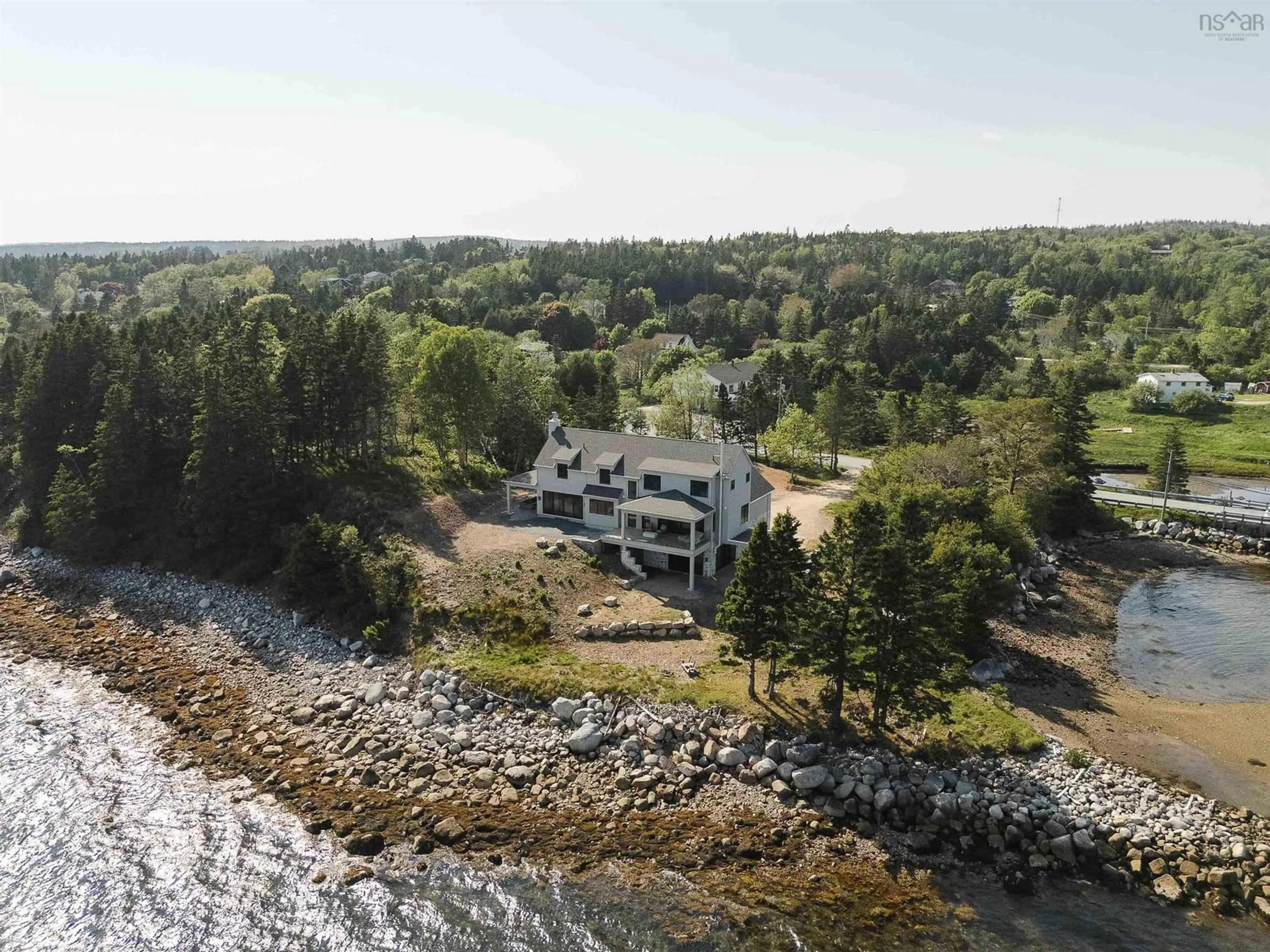 A pic from outside/outdoor area/front of a property/back of a property/a pic from drone, water/lake/river/ocean view for 7026 St Margarets Bay Rd, Boutiliers Point Nova Scotia B3Z 1W1