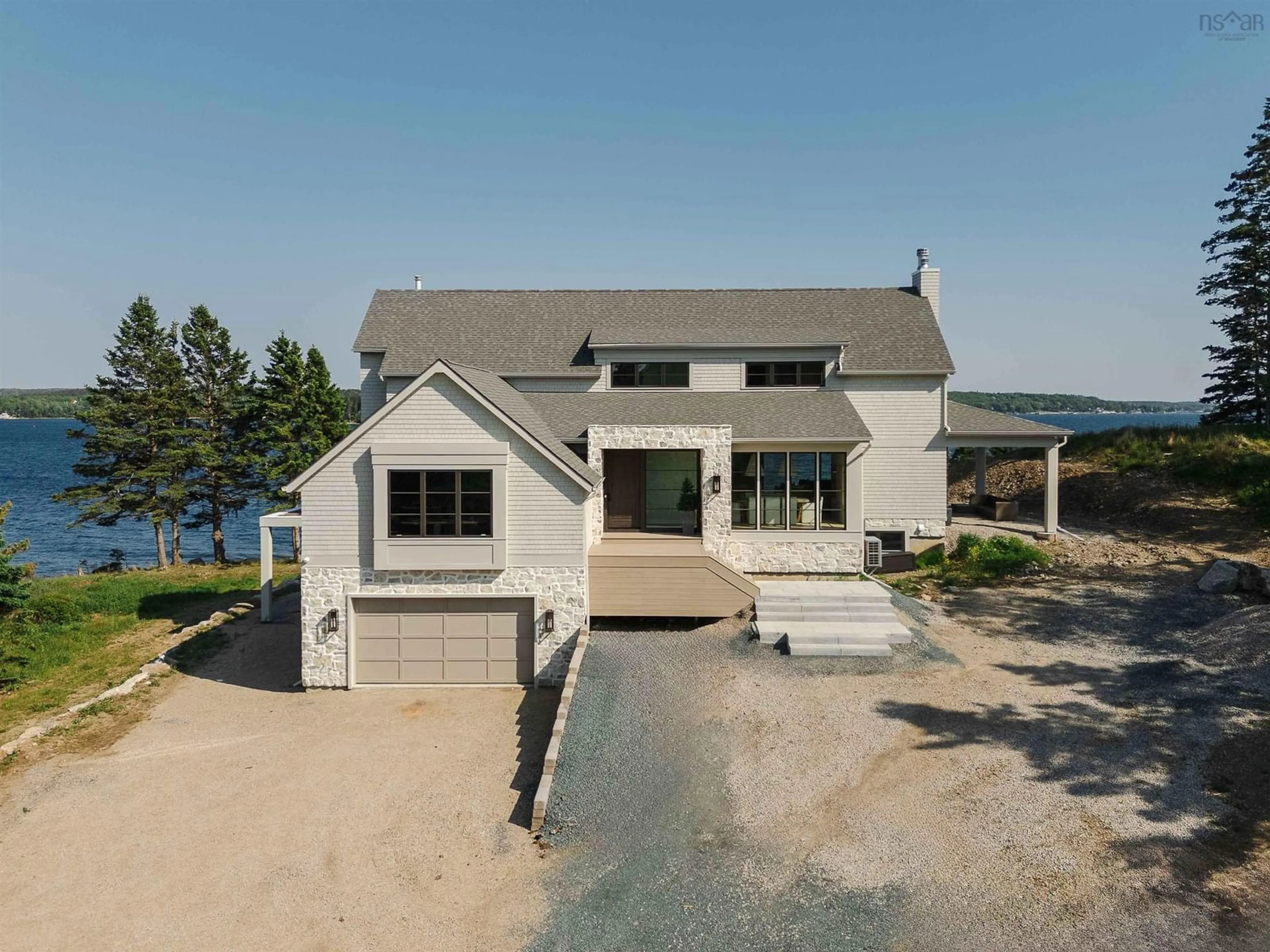 A pic from outside/outdoor area/front of a property/back of a property/a pic from drone, water/lake/river/ocean view for 7026 St Margarets Bay Rd, Boutiliers Point Nova Scotia B3Z 1W1