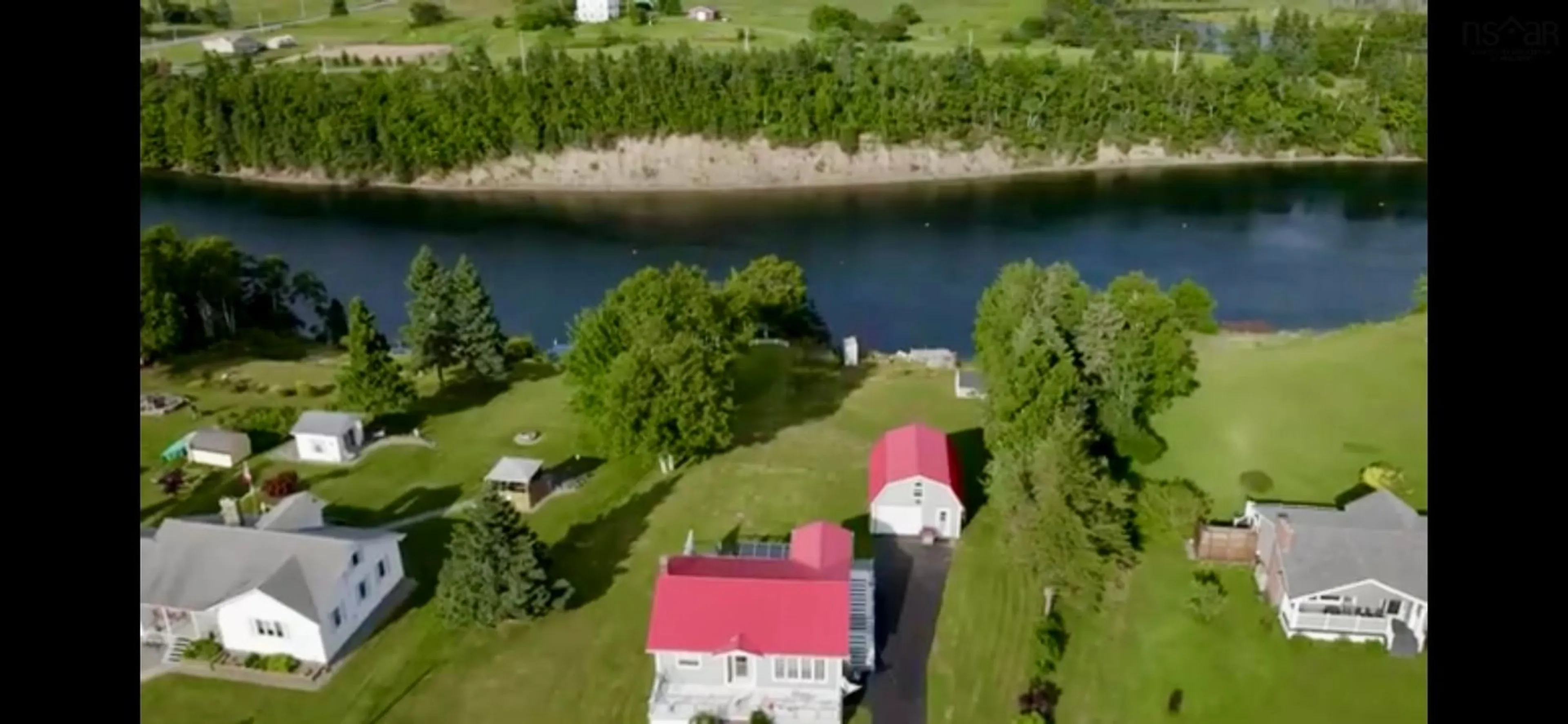 A pic from outside/outdoor area/front of a property/back of a property/a pic from drone, water/lake/river/ocean view for 192 Point Aconi Rd, Mill Creek Nova Scotia B1Y 1W3