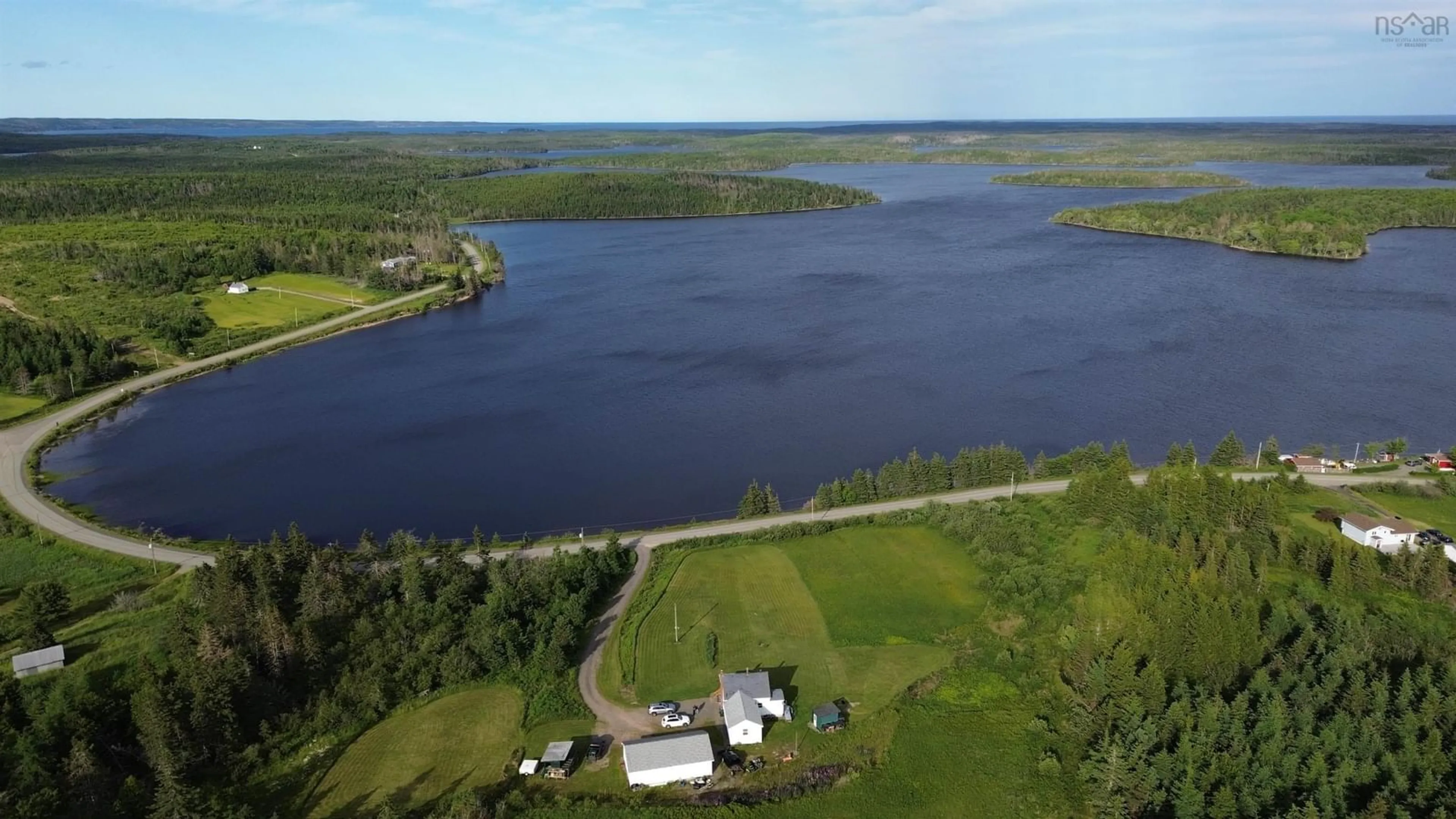 A pic from outside/outdoor area/front of a property/back of a property/a pic from drone, water/lake/river/ocean view for 922 Fourchu Rd, Gabarus Lake Nova Scotia B1K 2C9