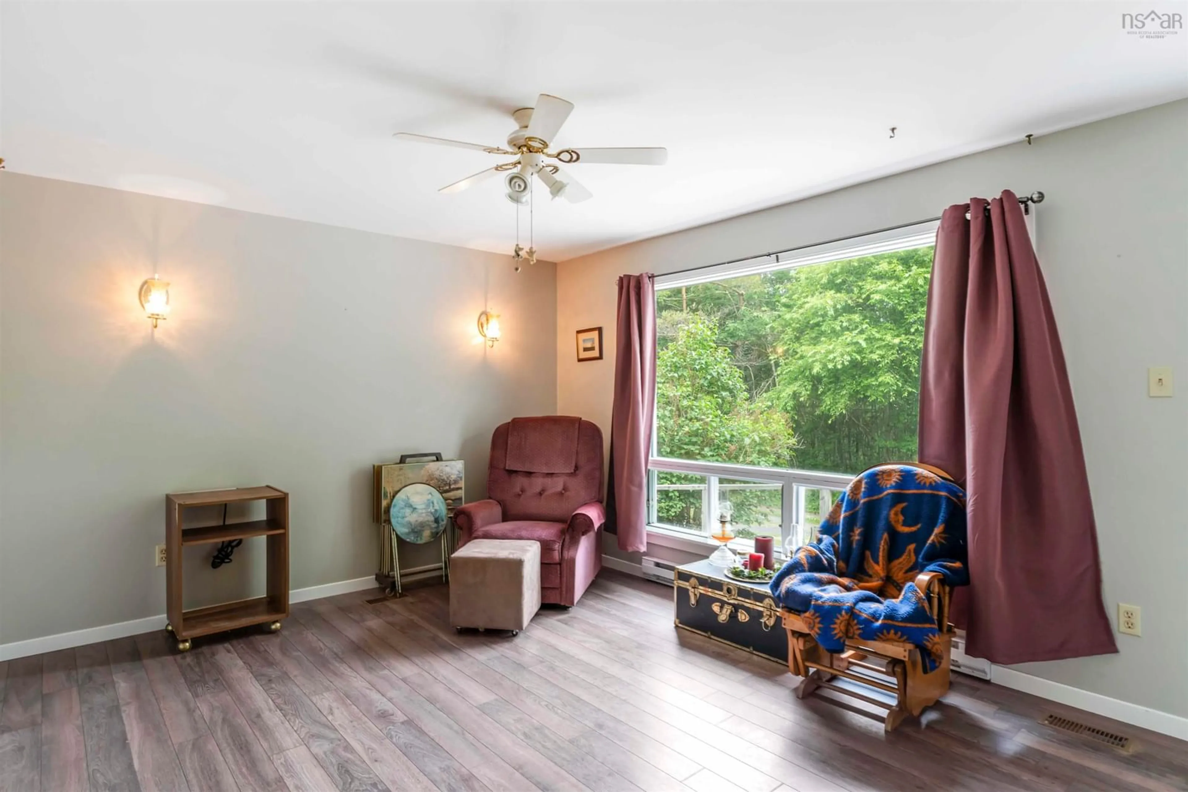 Living room with furniture, wood/laminate floor for 145 Peck Hill, Bear River Nova Scotia B0S 1B0