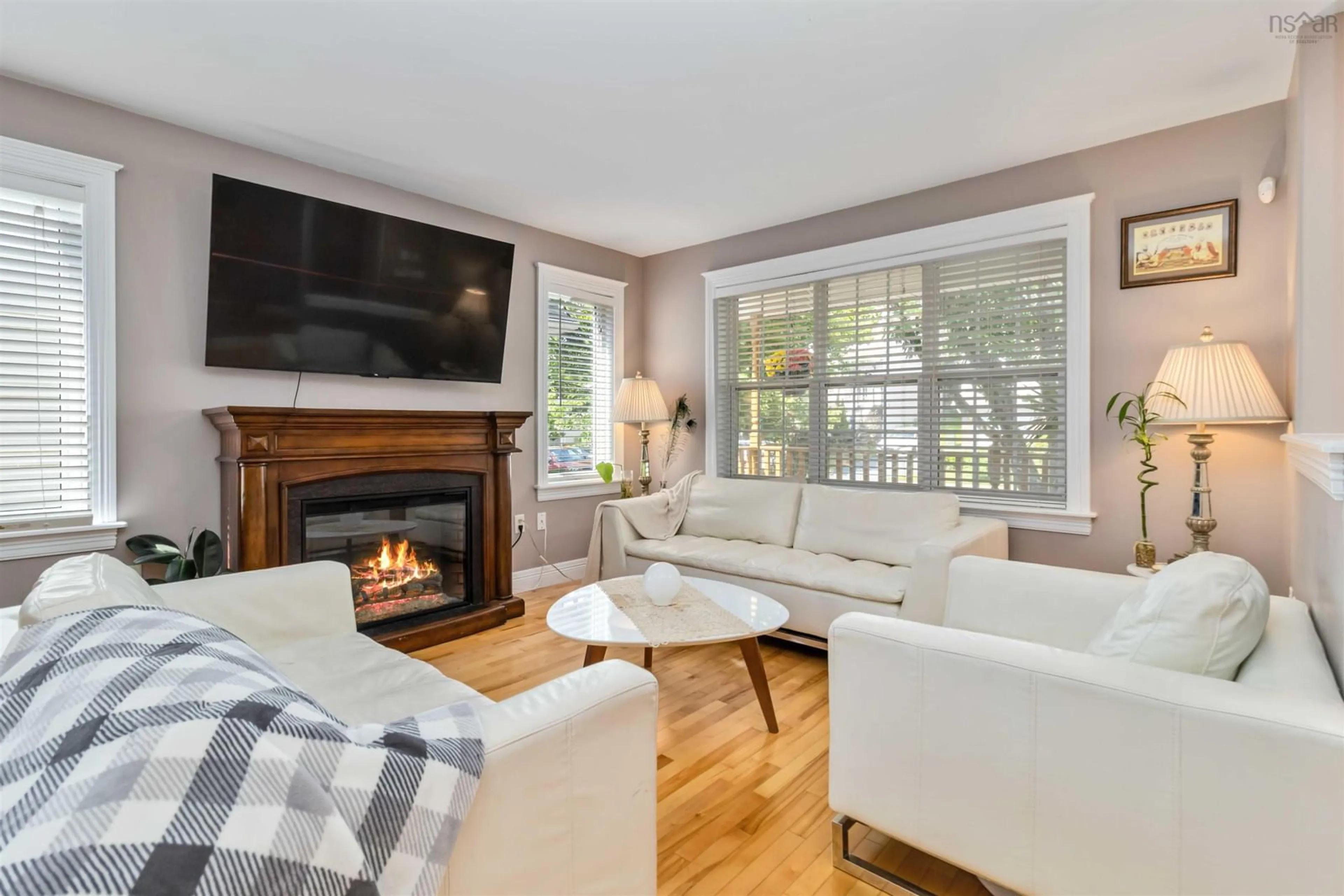 Living room with furniture, wood/laminate floor for 83 Red Fern Terr, Halifax Nova Scotia B3S 1K9