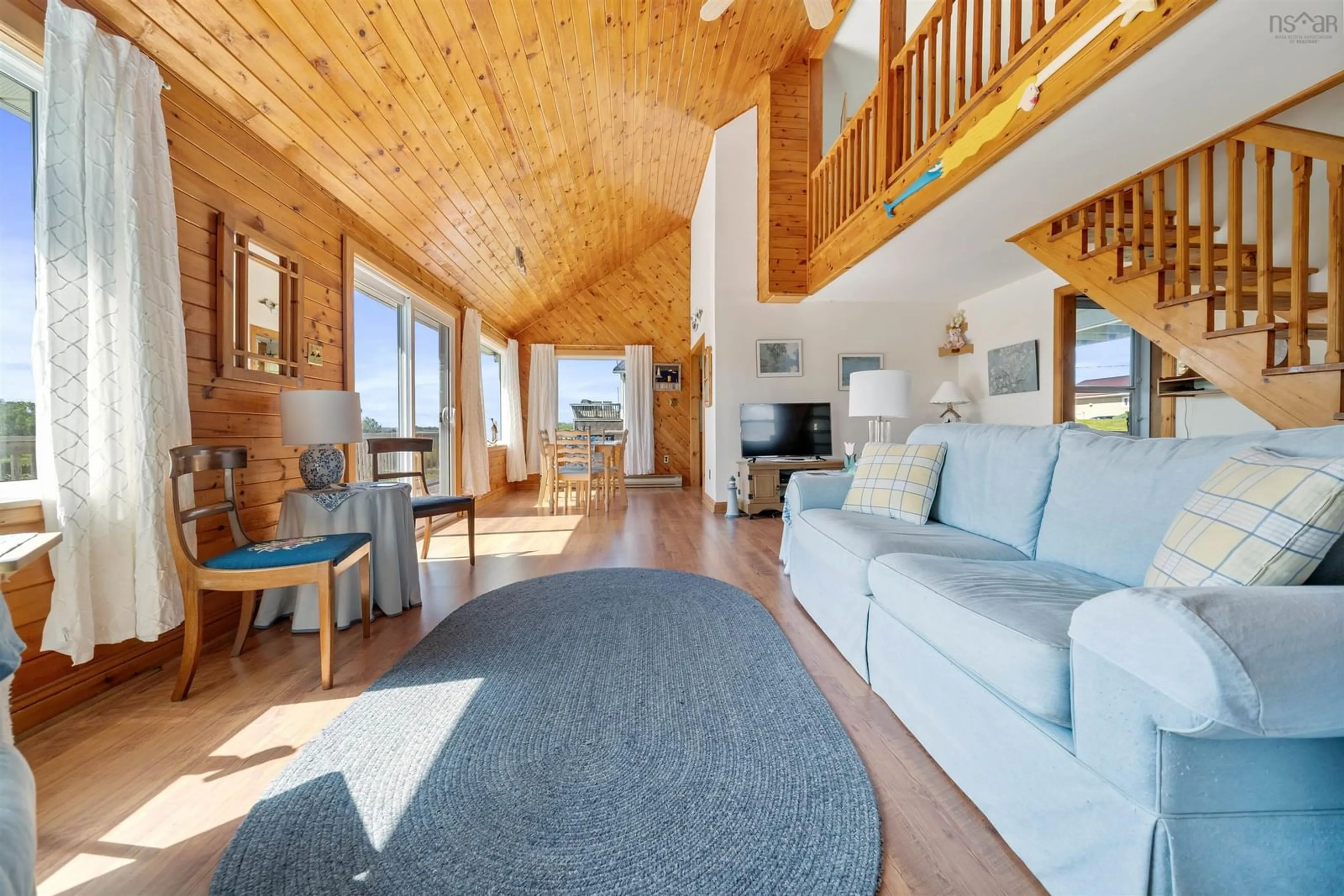 Living room with furniture, wood/laminate floor for 23 Hilltop Lane, Caribou Island Nova Scotia B0K 1H0