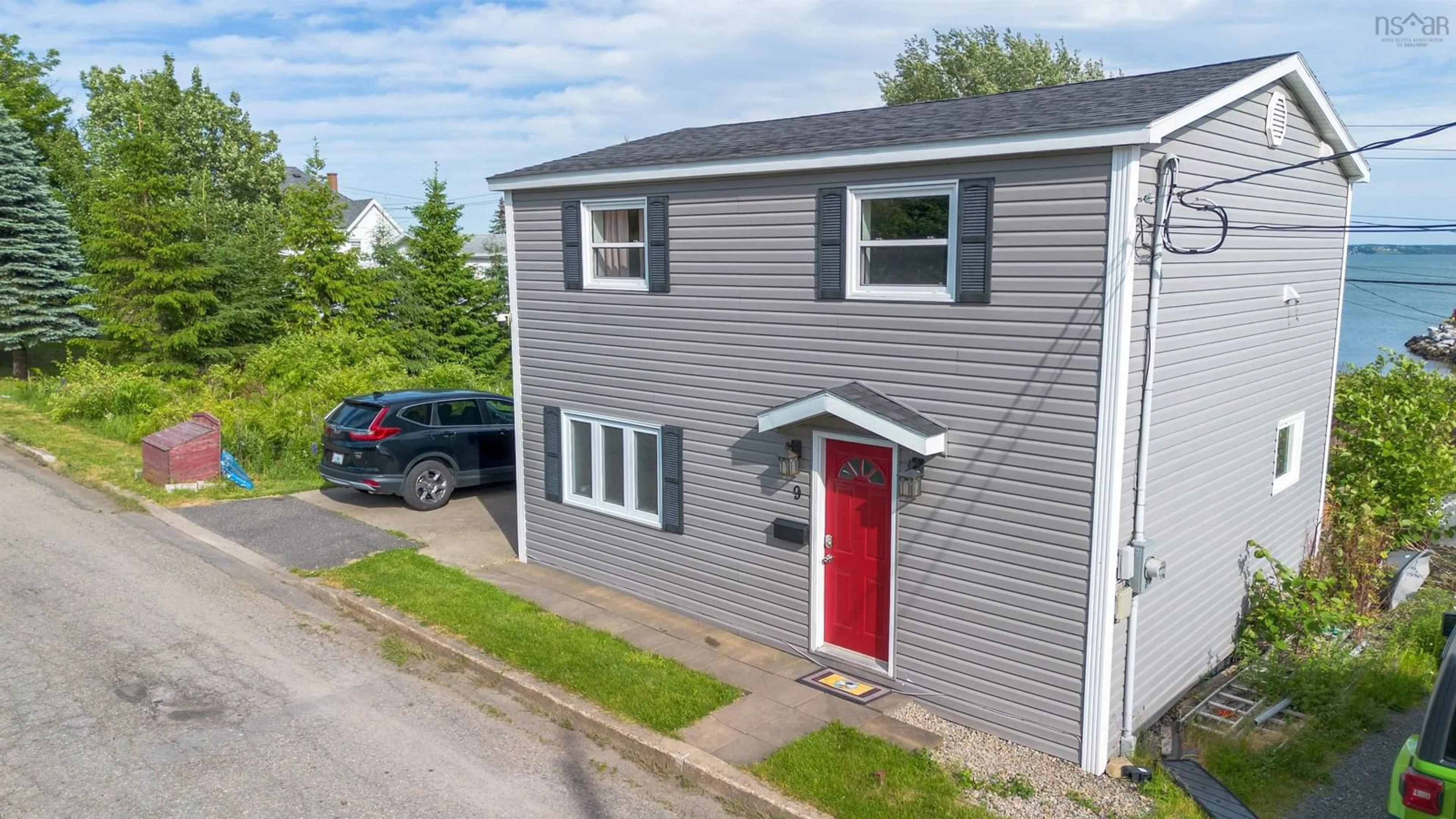 A pic from outside/outdoor area/front of a property/back of a property/a pic from drone, street for 9 Cogan St, North Sydney Nova Scotia B2A 3A7