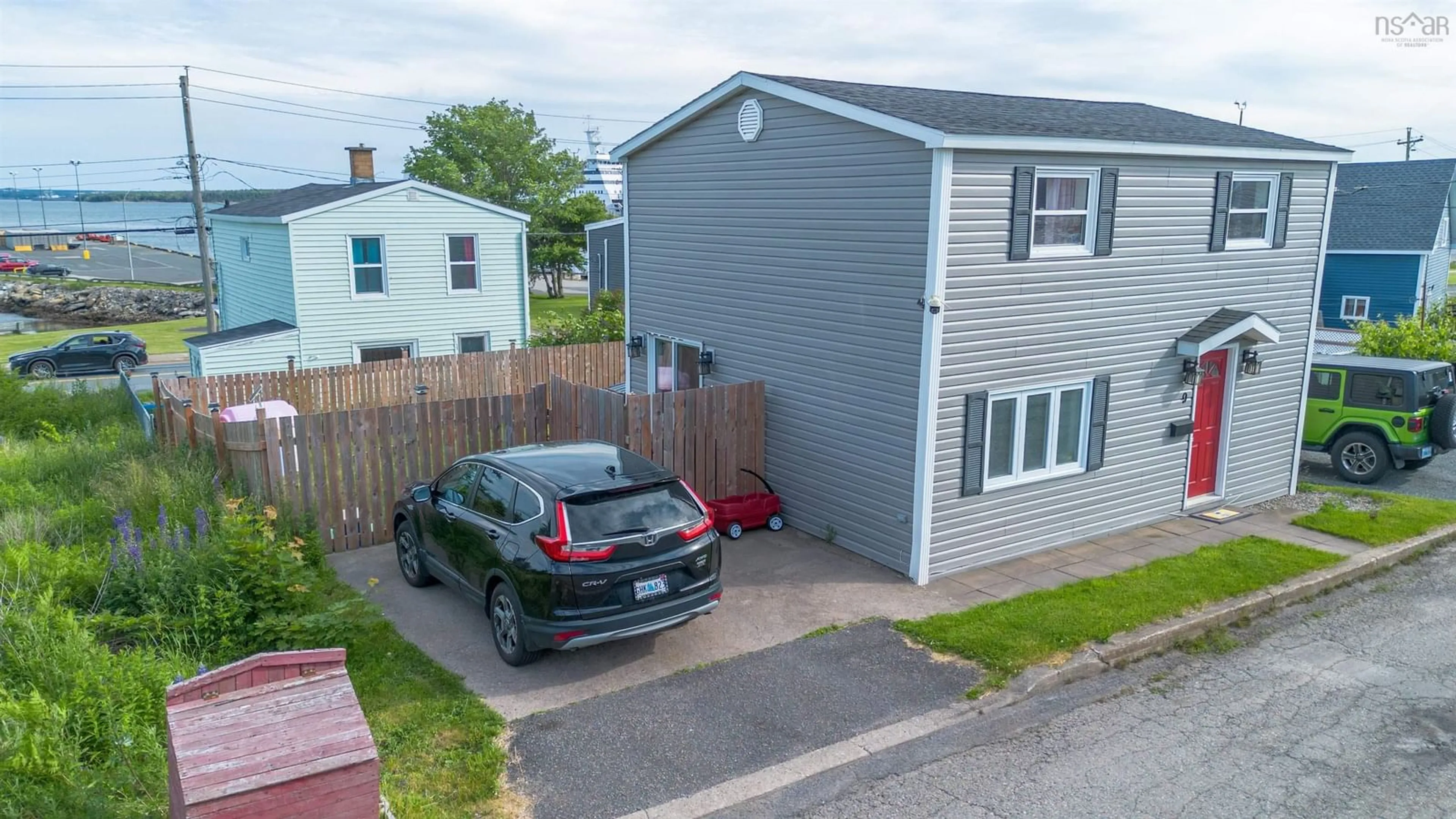 A pic from outside/outdoor area/front of a property/back of a property/a pic from drone, street for 9 Cogan St, North Sydney Nova Scotia B2A 3A7