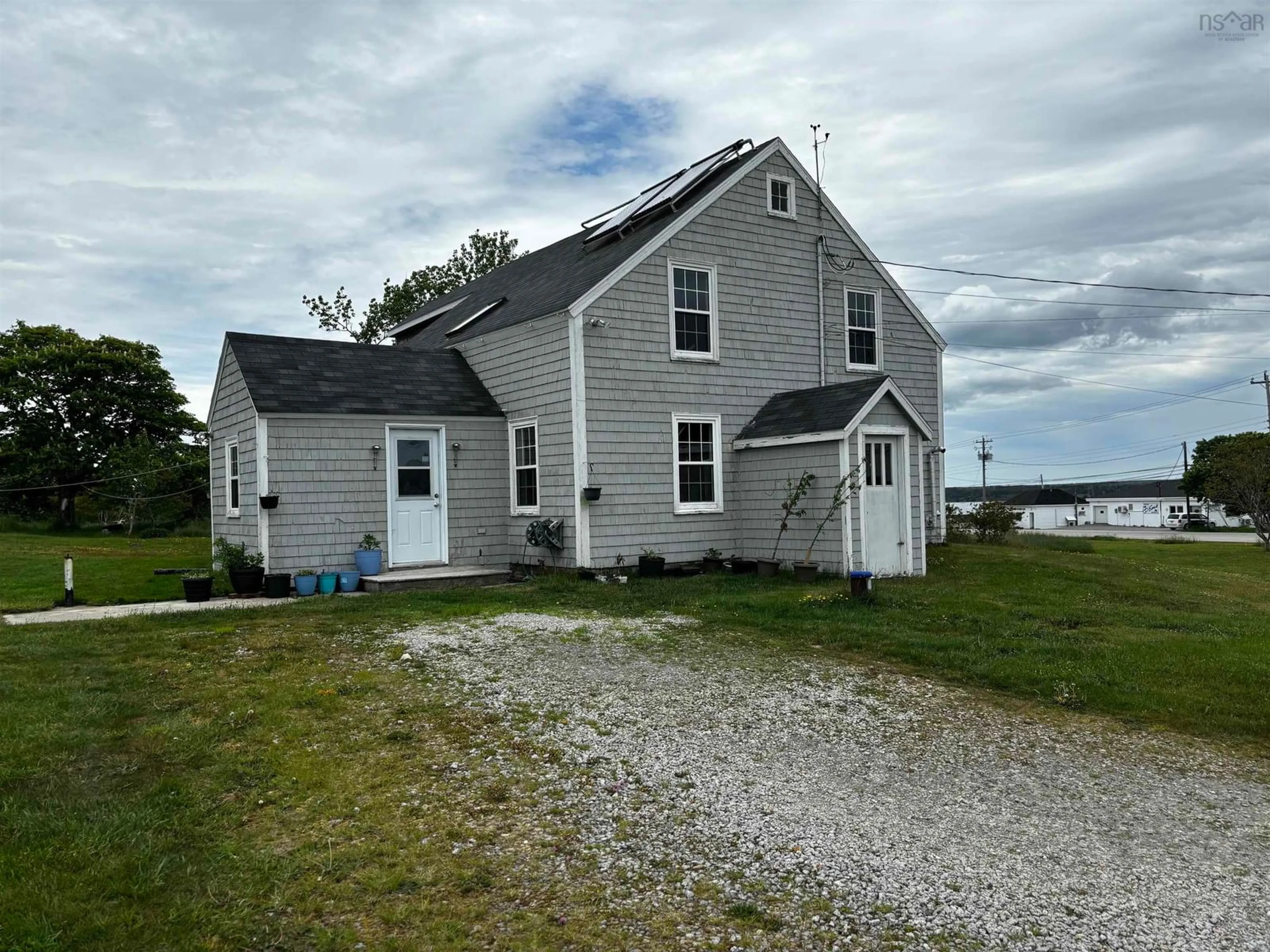 A pic from outside/outdoor area/front of a property/back of a property/a pic from drone, water/lake/river/ocean view for 712 Highway 335, West Pubnico Nova Scotia B0W 3S0