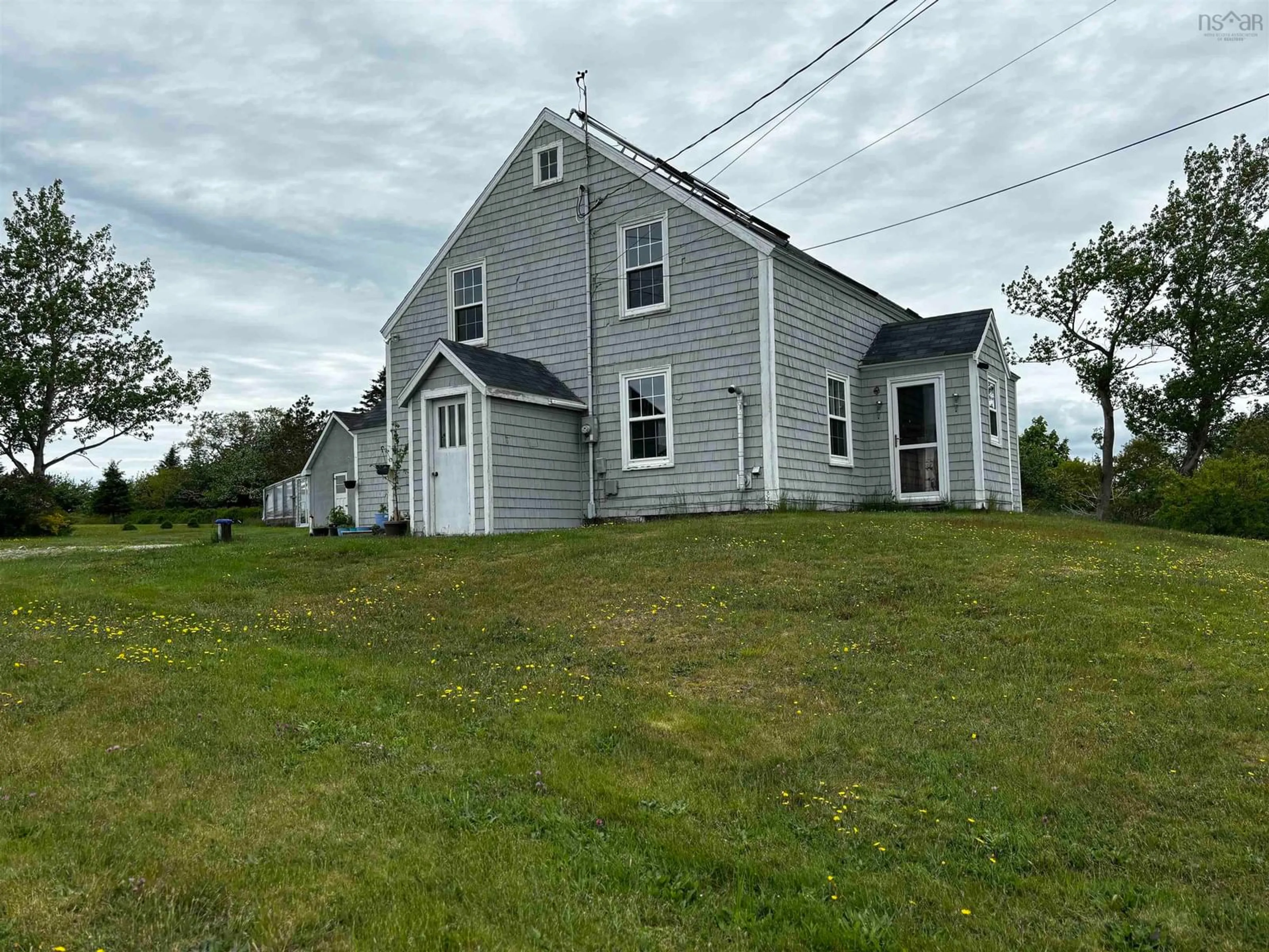 A pic from outside/outdoor area/front of a property/back of a property/a pic from drone, building for 712 Highway 335, West Pubnico Nova Scotia B0W 3S0