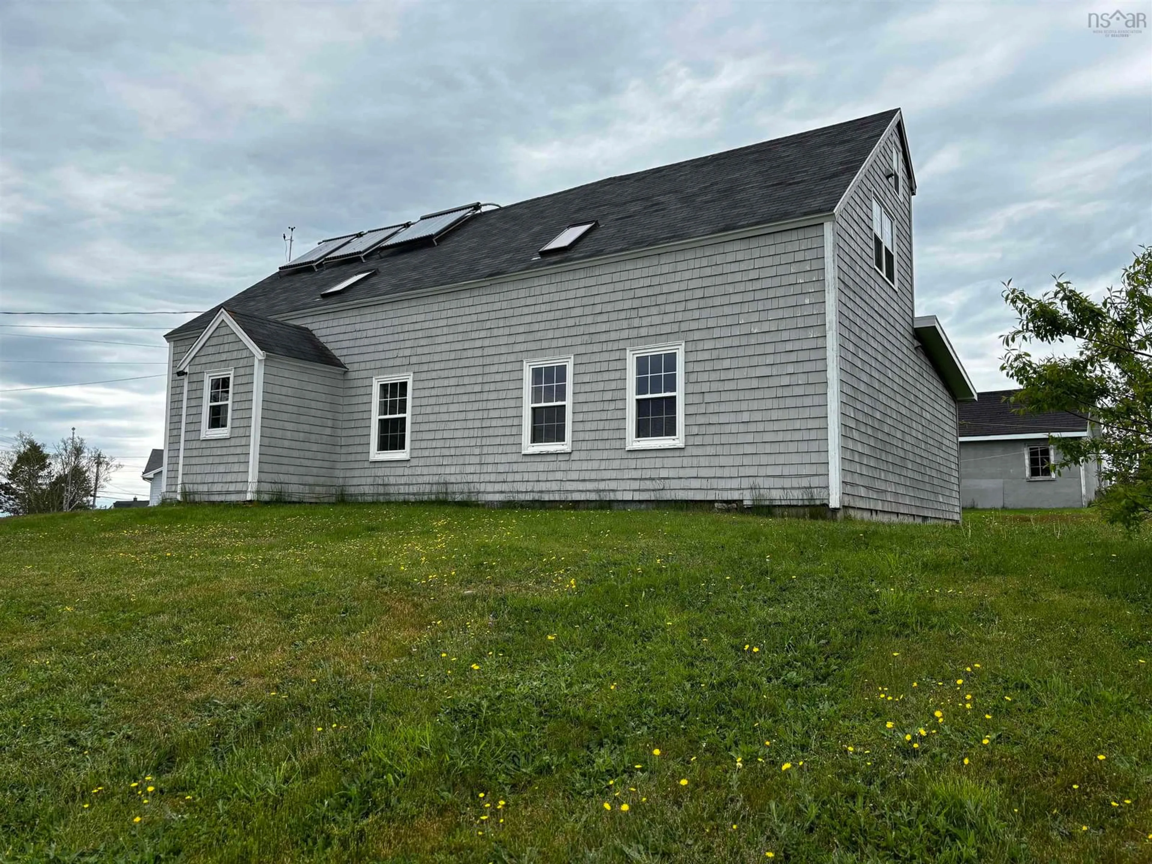 A pic from outside/outdoor area/front of a property/back of a property/a pic from drone, building for 712 Highway 335, West Pubnico Nova Scotia B0W 3S0