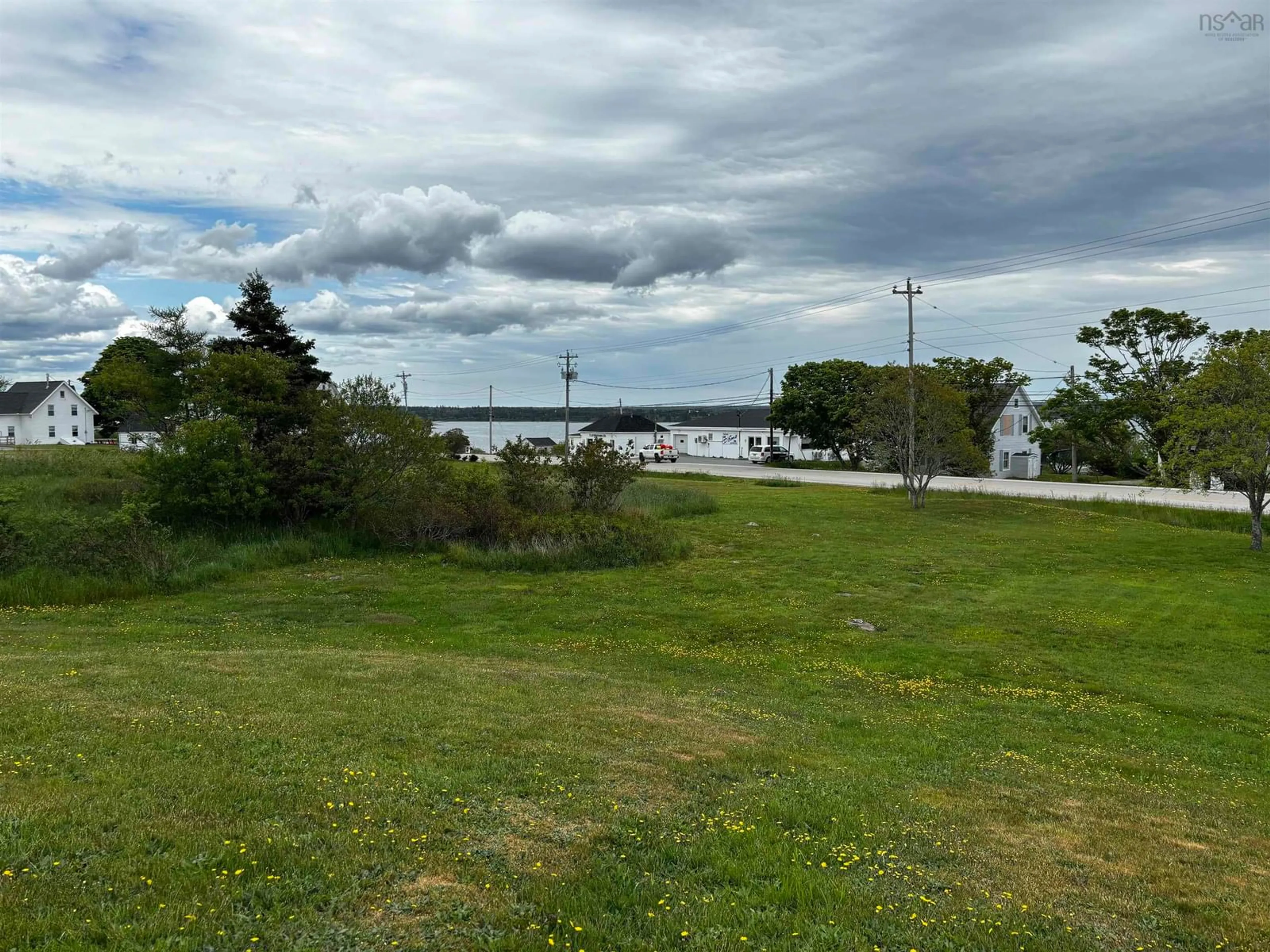 A pic from outside/outdoor area/front of a property/back of a property/a pic from drone, water/lake/river/ocean view for 712 Highway 335, West Pubnico Nova Scotia B0W 3S0