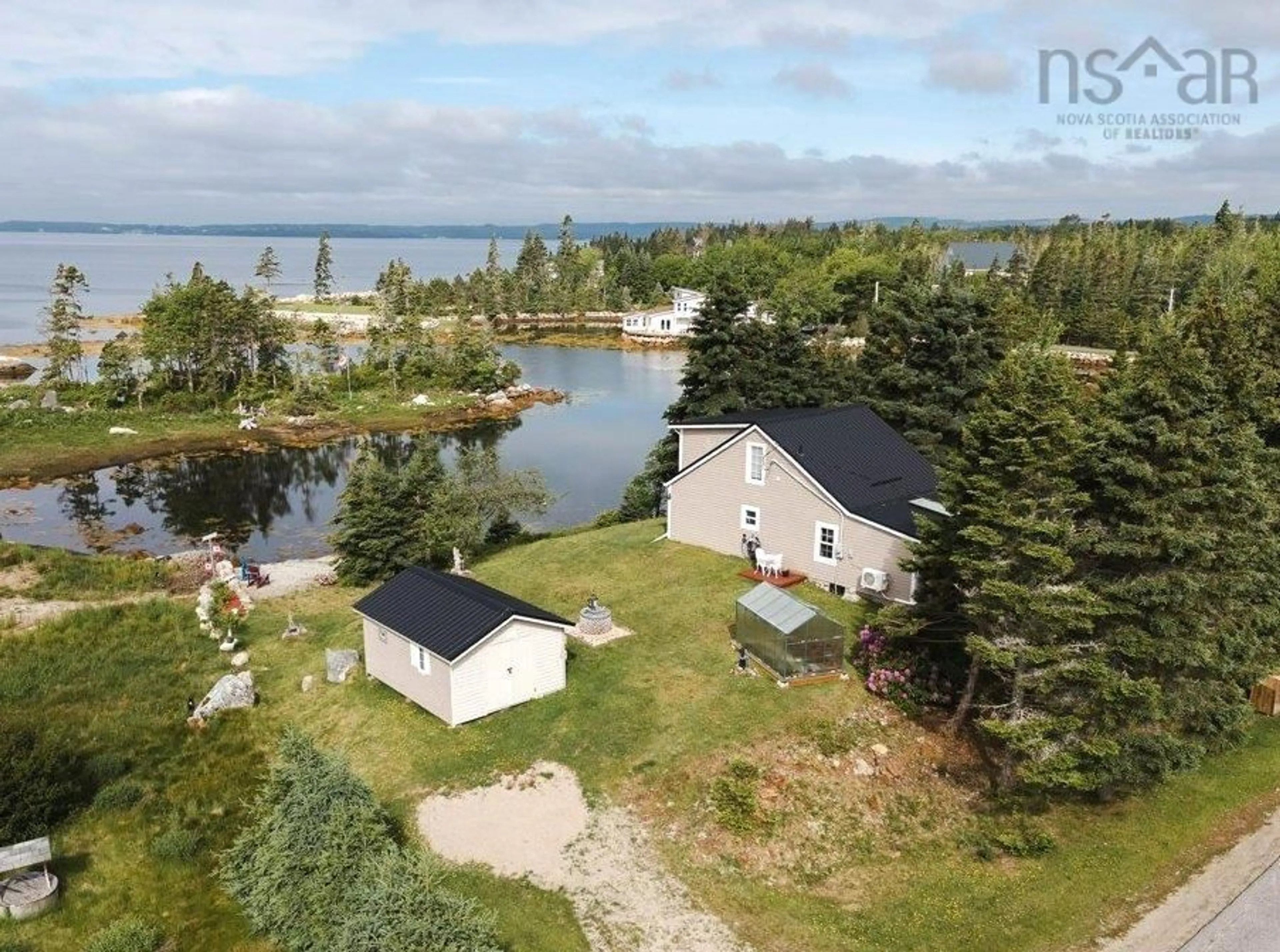 A pic from outside/outdoor area/front of a property/back of a property/a pic from drone, water/lake/river/ocean view for 7187 Highway 329, East River Nova Scotia B0J 1T0