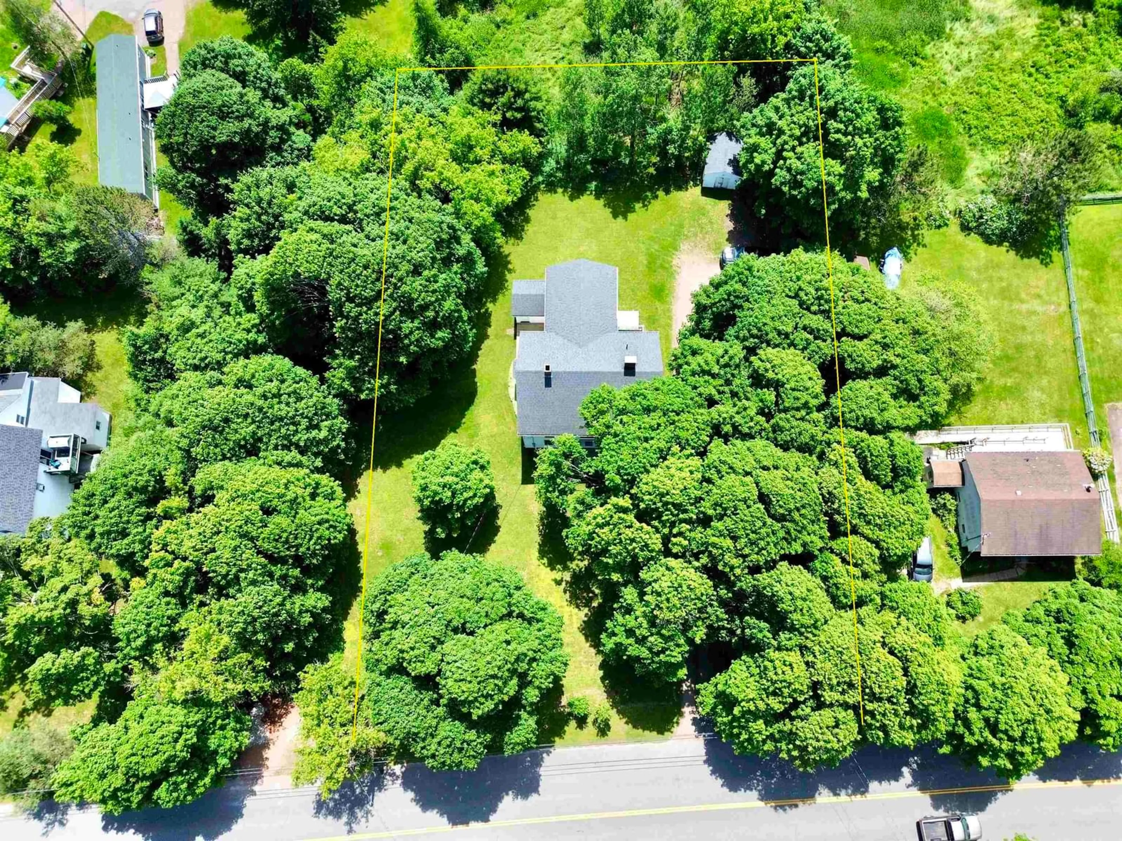 A pic from outside/outdoor area/front of a property/back of a property/a pic from drone, forest/trees view for 102 Victoria St, Amherst Nova Scotia B4H 1C8