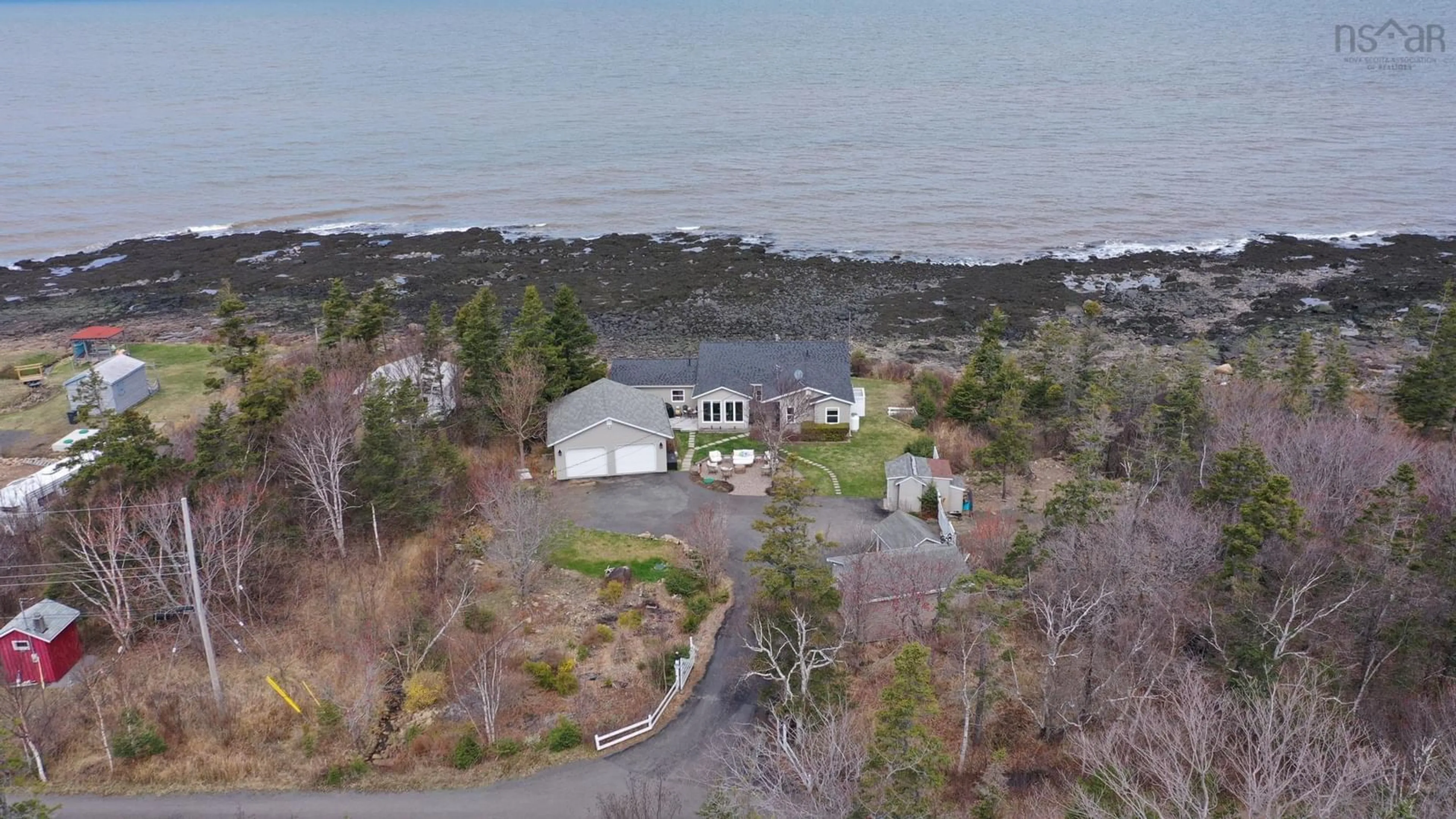 A pic from outside/outdoor area/front of a property/back of a property/a pic from drone, water/lake/river/ocean view for 59 Sunset Ave, Phinneys Cove Nova Scotia B0S 1P0