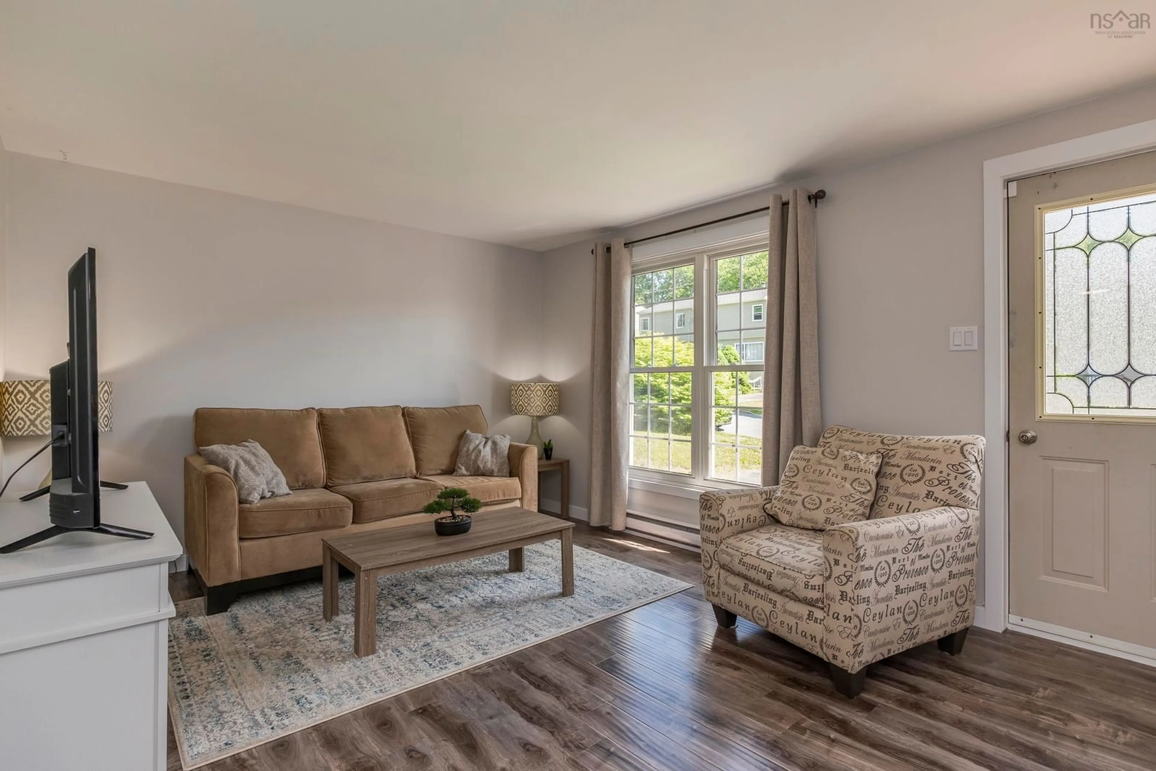 Living room with furniture, wood/laminate floor for 49 Rogers Dr, Lower Sackville Nova Scotia B4C 3G3