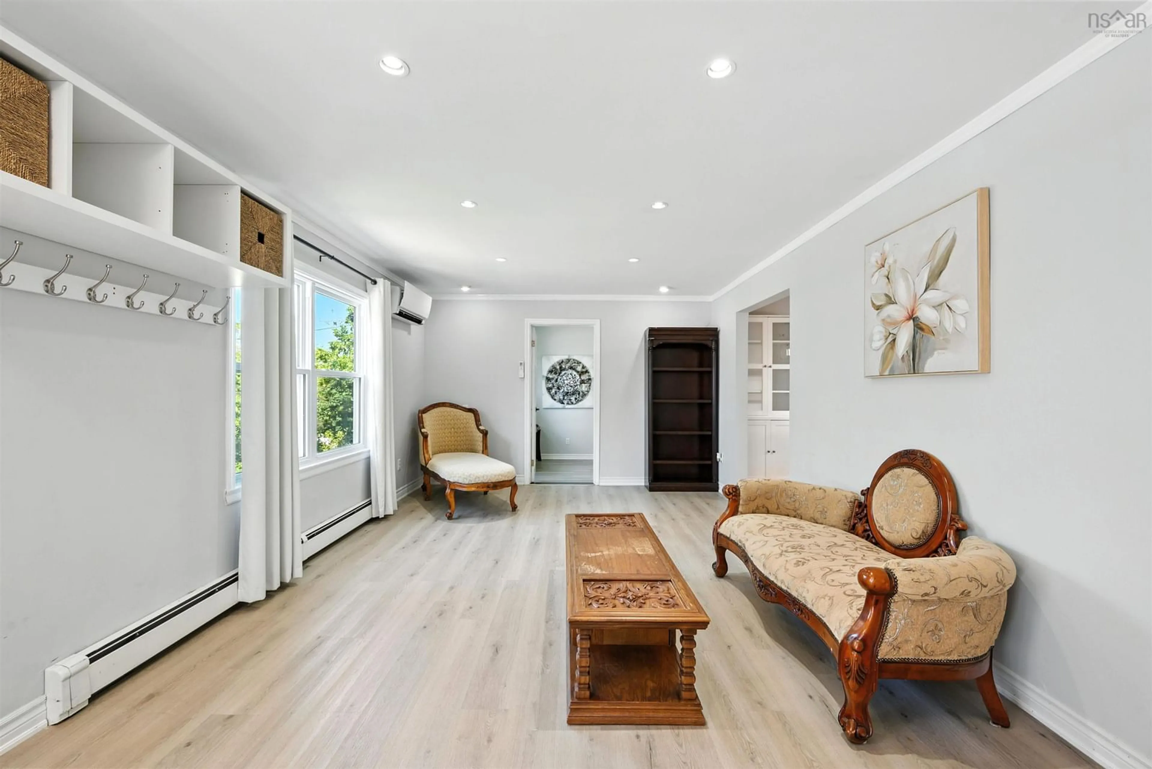 Living room with furniture, wood/laminate floor for 264 Highland Ave, Windsor Nova Scotia B0N 2T0
